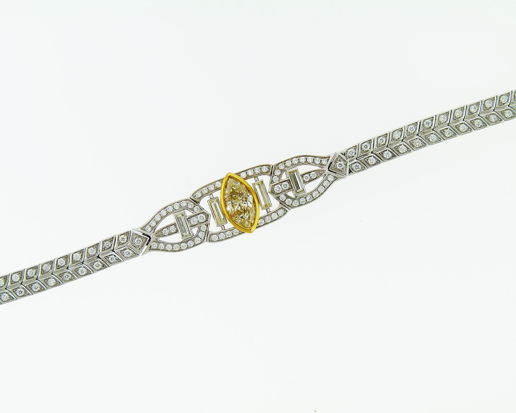 Beautiful bracelet embellished with the fancy yellow marquise center diamond weighing 1.51 carats total and mixed shape white diamonds weighing 2.00 carats total. The bracelet is made in white and yellow 18K gold.

The white diamonds are equivalent