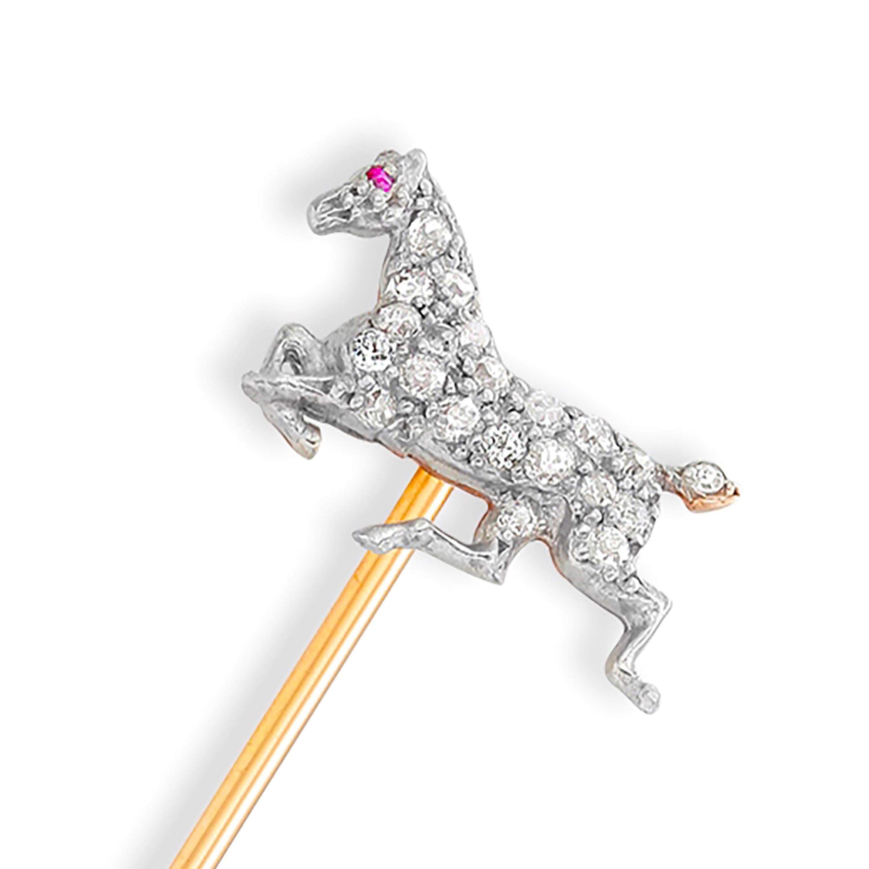 Vintage 18 karat yellow and white gold diamond and ruby horse stick pin
The body of the horse pave set with diamonds and a ruby as eye accent
Diamonds weighing approximately 0.45 carats
Horse measuring 0.65 inch x 045 inch
Accompanied by  E. Woodman