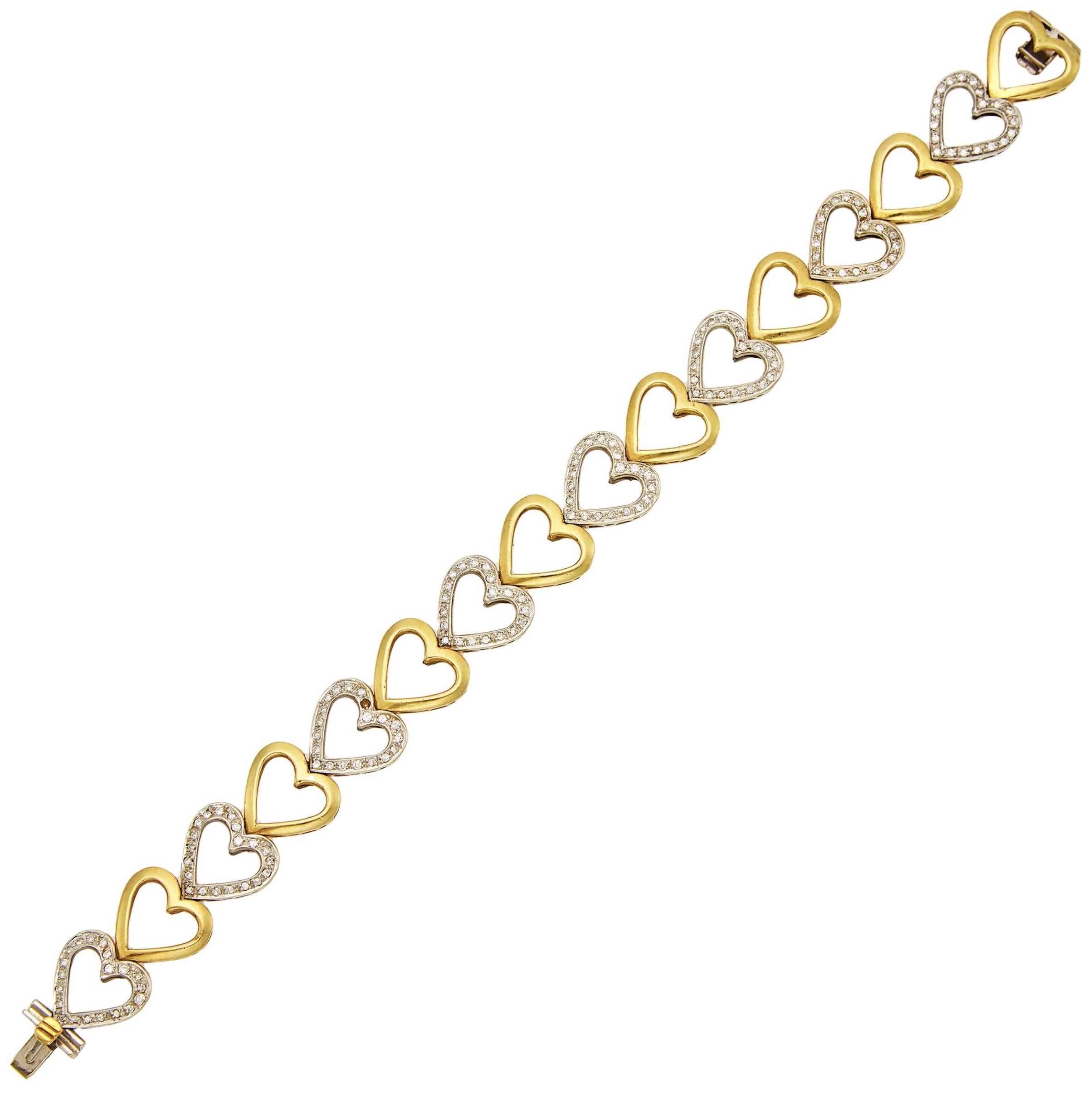 Yellow and White Gold Diamond Heart Link Bracelet

Details:
Yellow and white gold, 160 small round diamonds ap. 1.20 cts.
Length 8.19 inches
Weight: 39.6 grams

In excellent condition