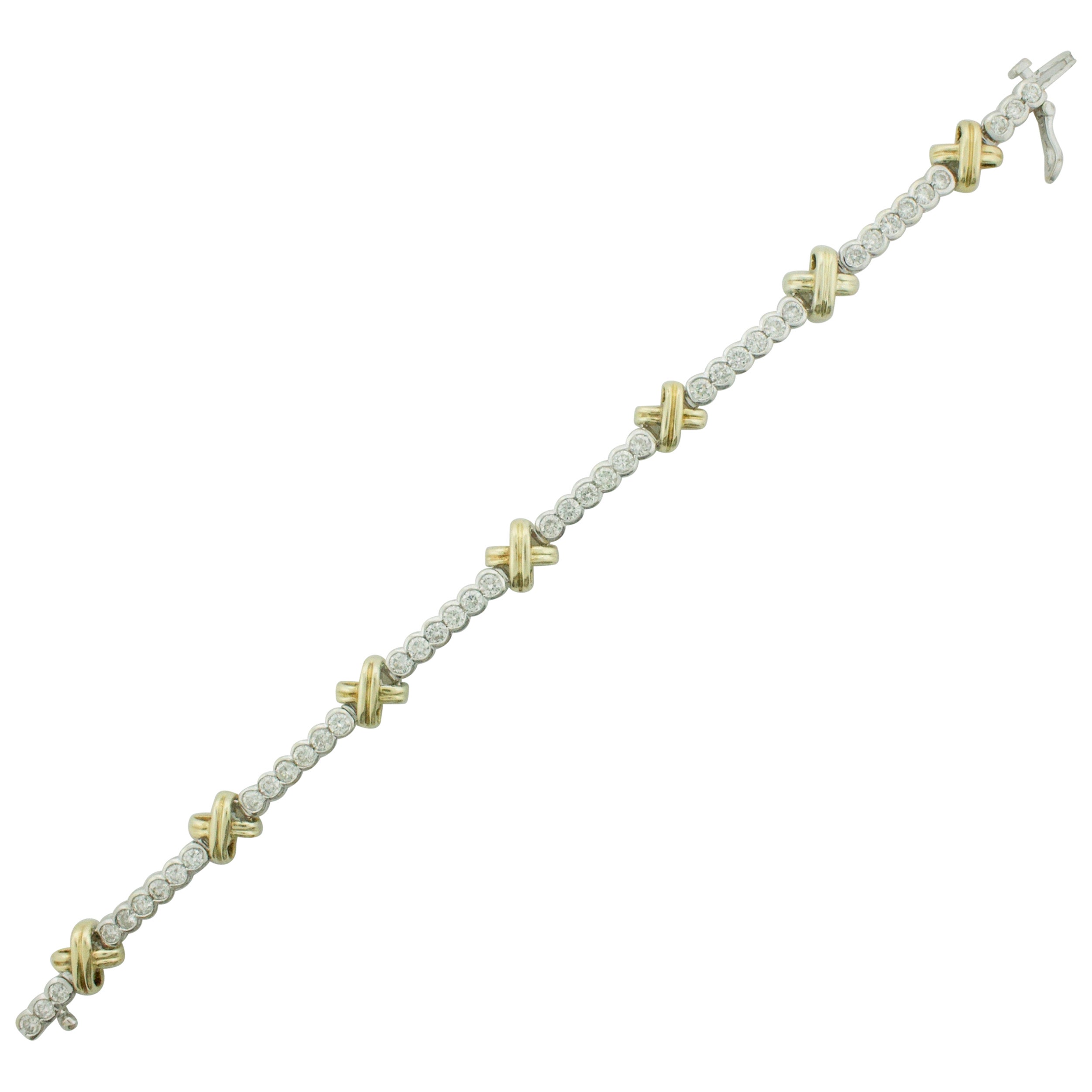 Bracciale tennis con diamanti "X" in oro giallo e bianco 3,75 carati