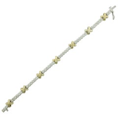 Bracciale tennis con diamanti "X" in oro giallo e bianco 3,75 carati