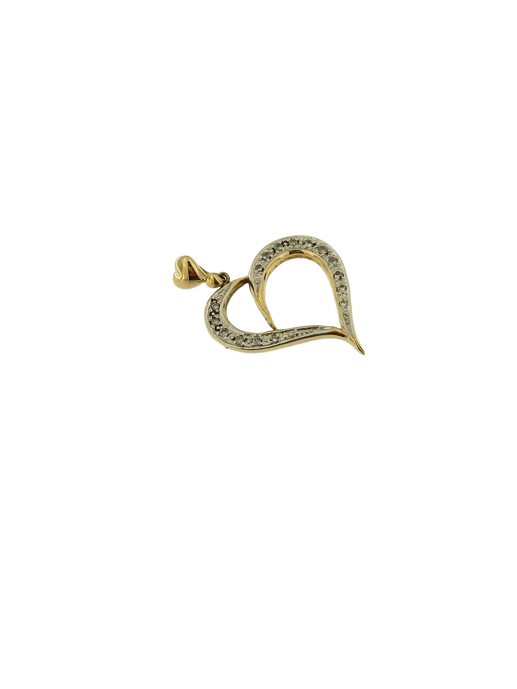 The Yellow and White Gold Heart Pendant with Diamonds is a symbol of love and elegance, crafted with meticulous attention to detail. Made from luxurious 18kt yellow and white gold, this pendant features a heart-shaped design that exudes timeless