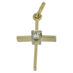 Croix solitaire en or jaune et blanc