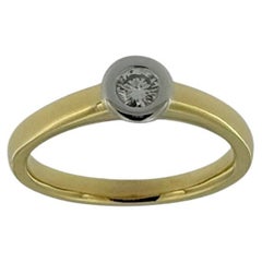 Bague solitaire en or jaune et blanc avec diamant naturel