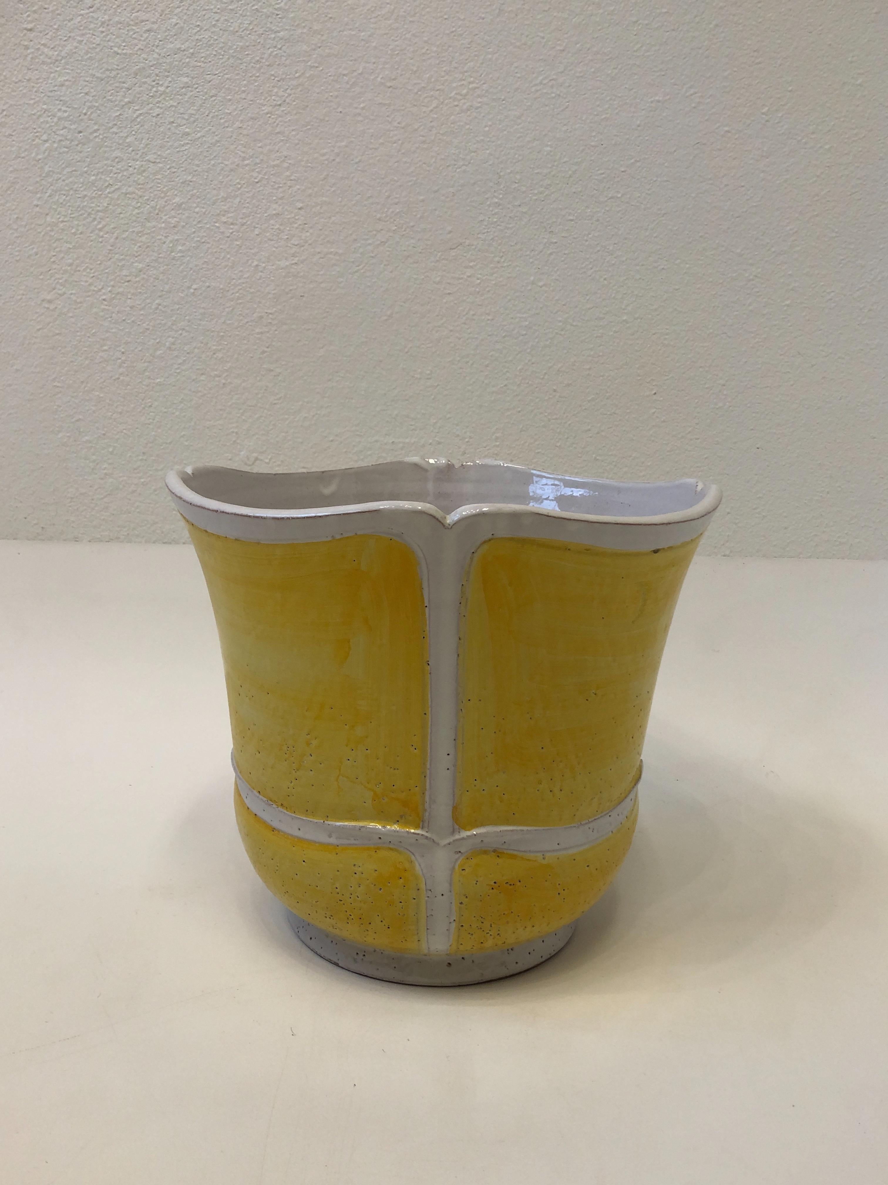 1970’s Italian ceramic planter. 
Glazed yellow and white.
Retains hand made in Italy label. 
Measurements: 14” diameter 18” high.