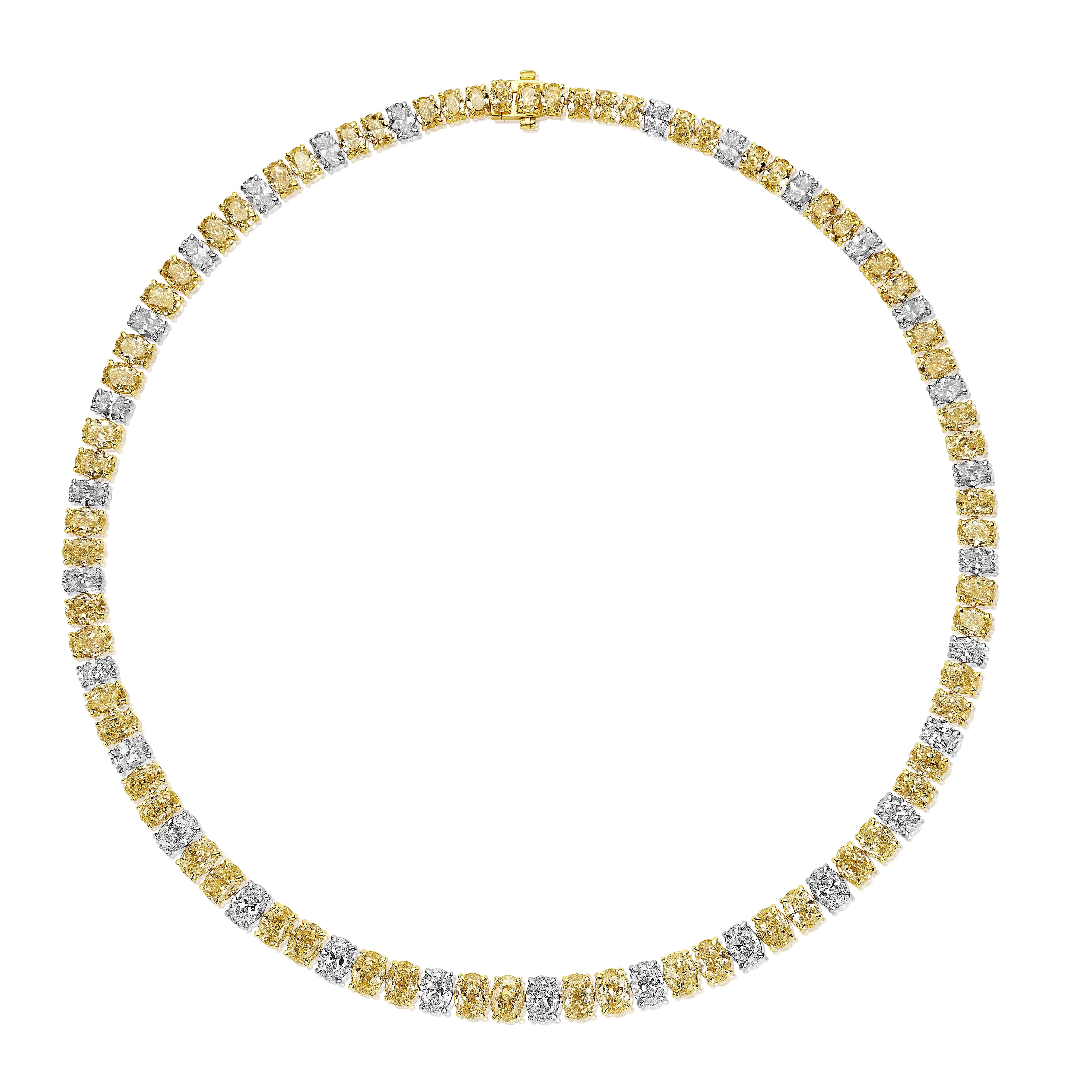 Gorgeous necklace comprised of 84 Oval Yellow and White Diamonds weighing a total of 42.40 Carats.
55 Yellow Diamonds and 29 White Diamonds.
Measures 16 inches.
Set in 18 Karat Gold.