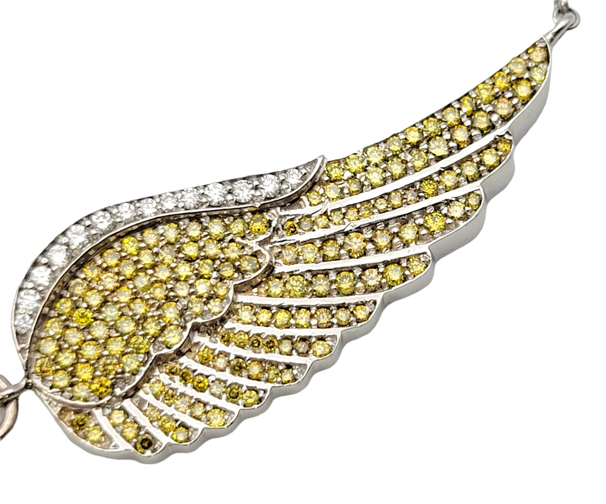 Contemporary Yellow and White Pave Diamond Cross and Wings Necklace in 14 Karat White Gold For Sale