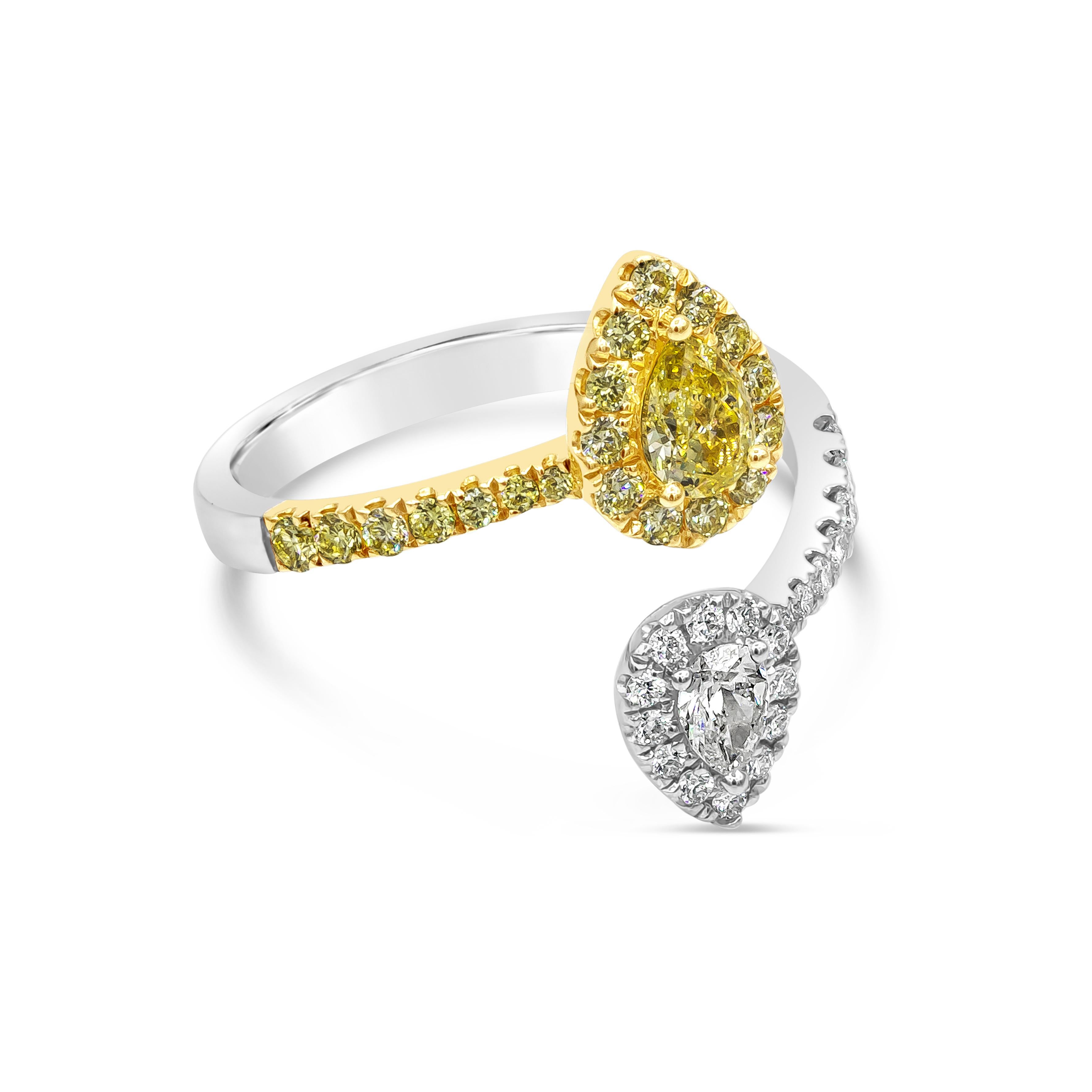 A very chic and fashionable ring showcasing a pear shape yellow diamond surrounded by a row of yellow diamonds, attached to a pear shape white diamond surrounded by white diamonds. Bypass Setting made in 18 karat two tone. Yellow diamonds weigh 0.53