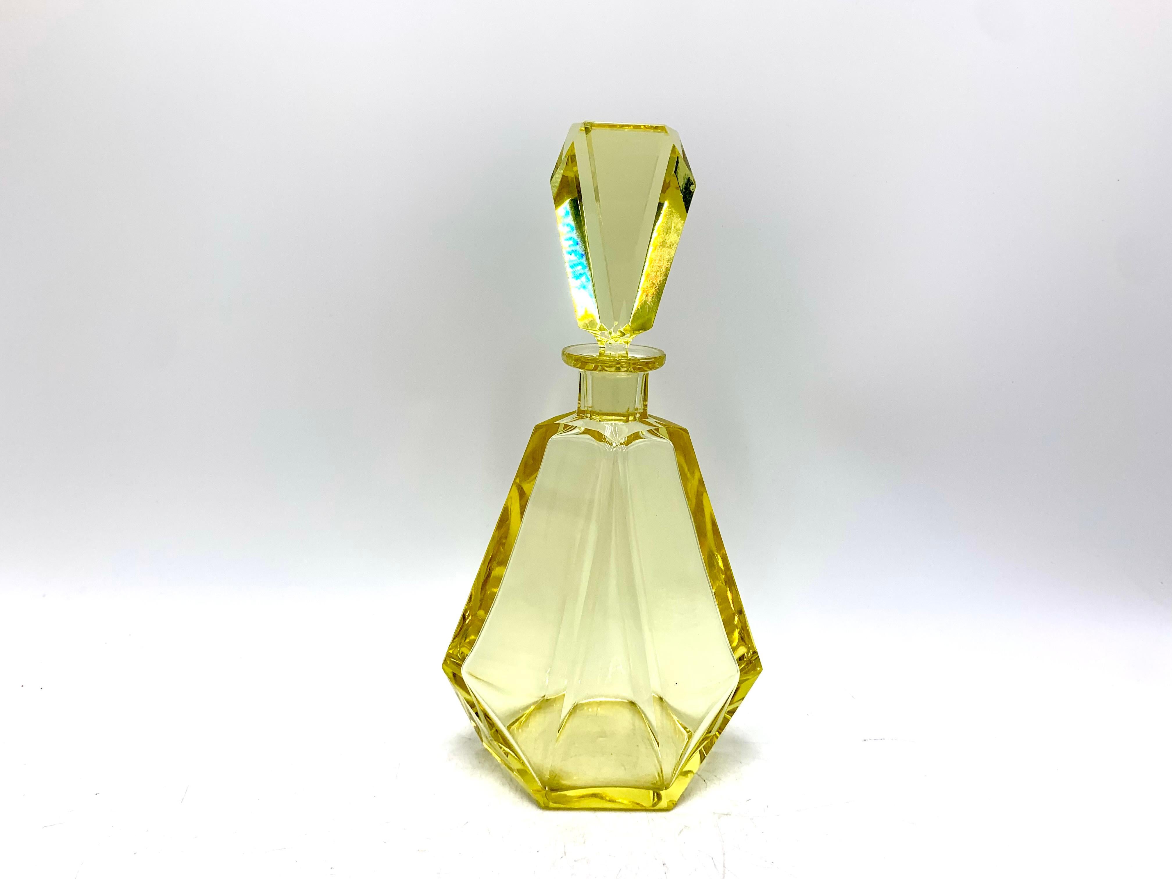 A beautiful Art Deco style crystal yellow decanter made in the Czech Republic in the 1930s. Very good condition, very slight traces of time.

Measures: height 25cm
width 13cm
depth 9cm.