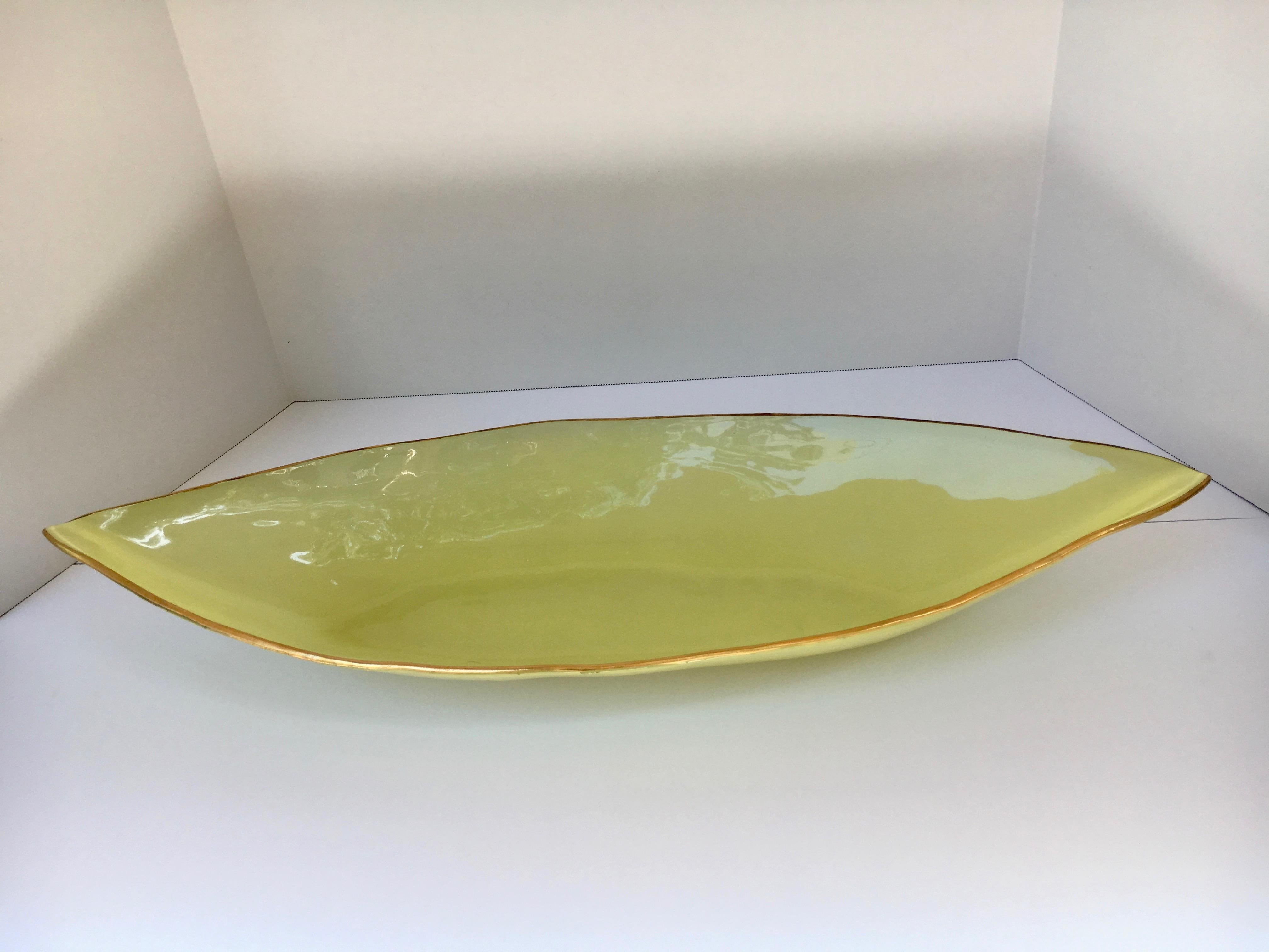 Yellow art glass bowl, yellow bowl with hand-painted gold trim, uses from food to decorative, unique oblong shape well suited for the elongated dining table.