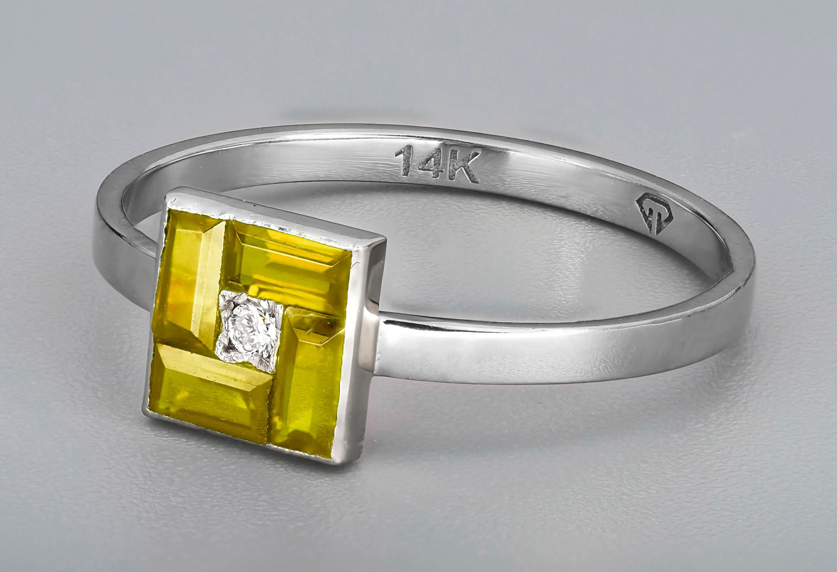 Modern Yellow baguette 14k gold ring. For Sale