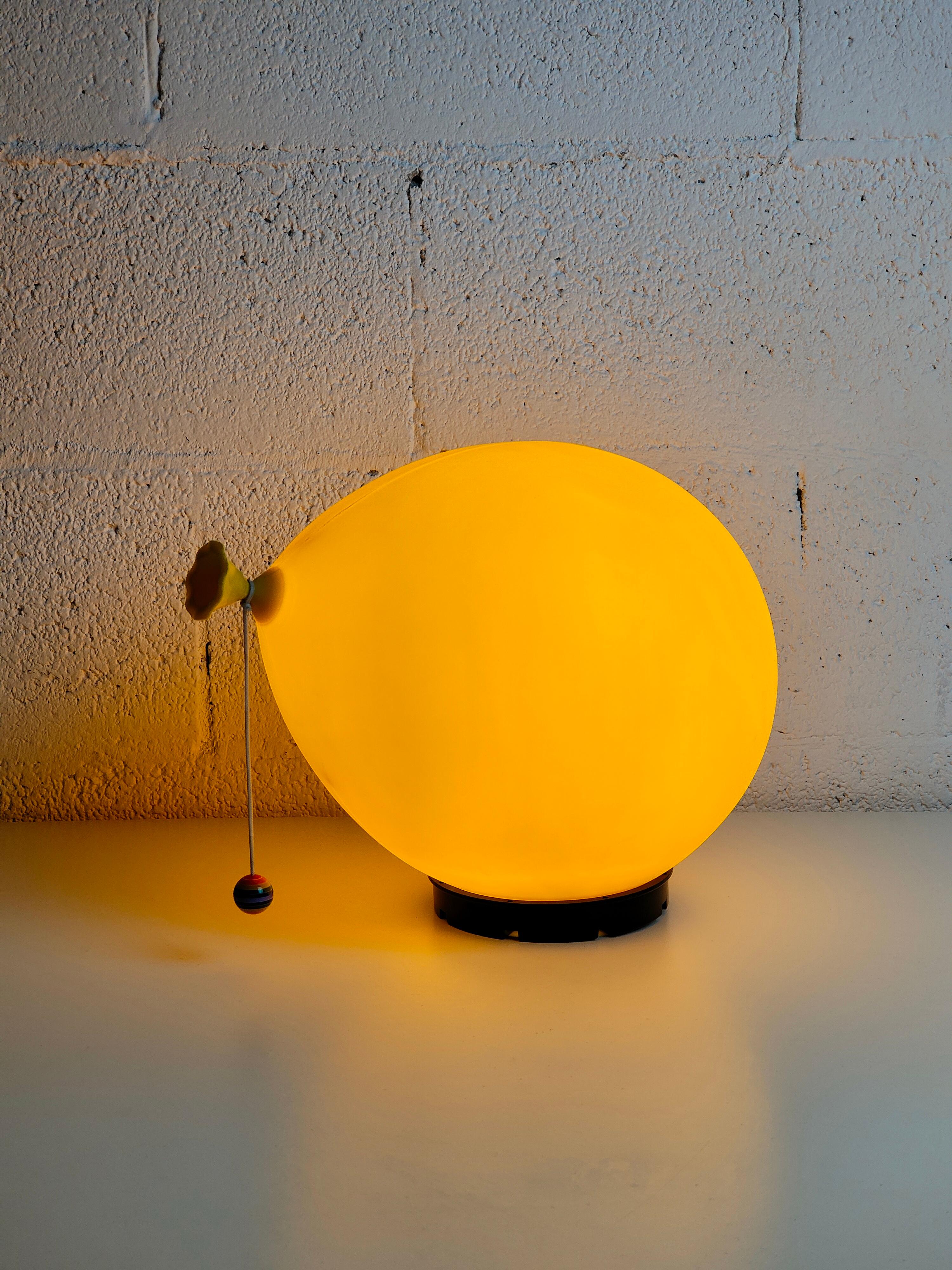 Modern wall lamp or sconce Balloon model design by Yves Christin and produced by Bilumen 1970s.
Yves Christin wanted to mimic the natural rise of a gas balloon.
When mounted on a wall, the lamp seems to be ascending towards the ceiling. The lamp