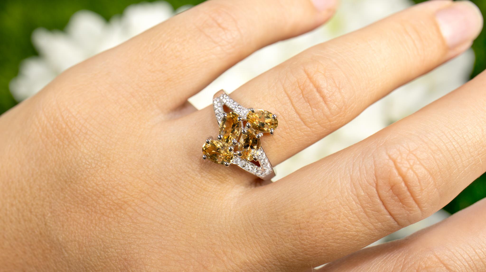 It comes with the Gemological Appraisal by GIA GG/AJP
Yellow Beryls are Natural in origin
White Zircons are synthetic in origin
4 Yellow Beryls = 1.60 Carats
20 White Zircons = 0.15 Carats
Metal: Rhodium Plated Sterling Silver
Ring Size: 7* US
*It