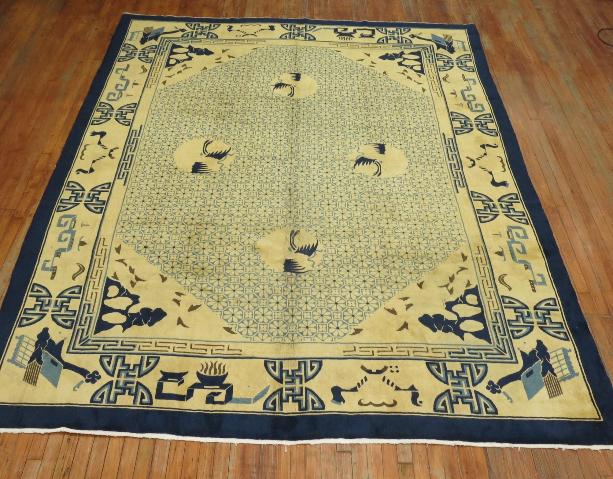 A mid 20th century room size Chinese rug in blue and yellow. The wool and feel of the rug is very soft on the feet. It has a silky sheen to it as well.

8'9'' x 11'7''