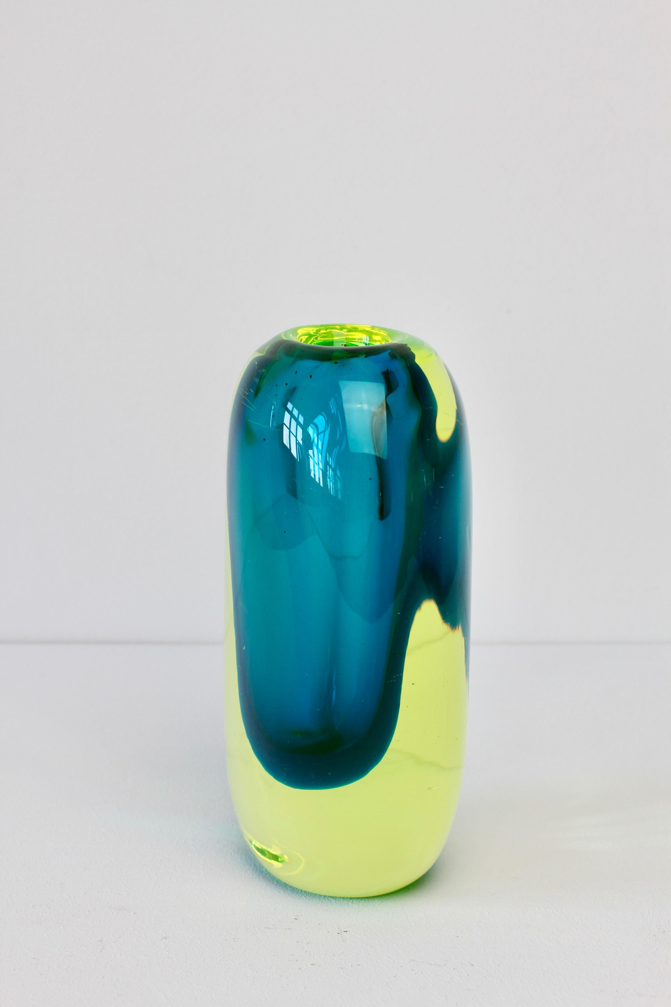 Vintage midcentury heavy and thick neon yellow over turquoise / blue colored glass vase attributed to Murano glass maker Cenedese. The style, form and colors of this piece do feel like that of known designs by Antonio da Ros - also similar to works