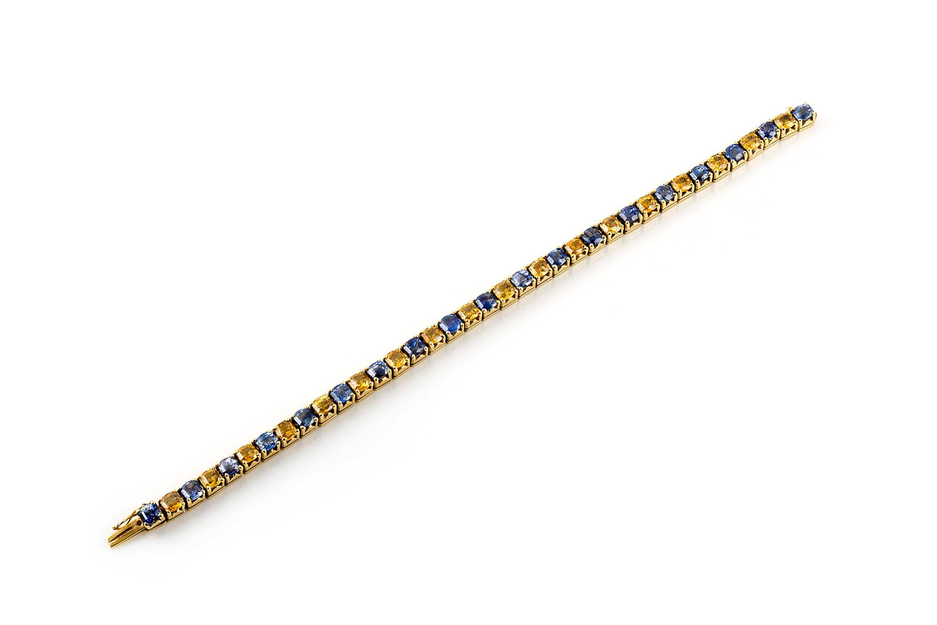 Tennisarmband, fein aus Gold gefertigt, mit blauen und gelben Saphiren von insgesamt 34,20 Karat. Die Länge des Armbands beträgt 7,5 Zoll/18,5 cm. Ca. 1970er Jahre.