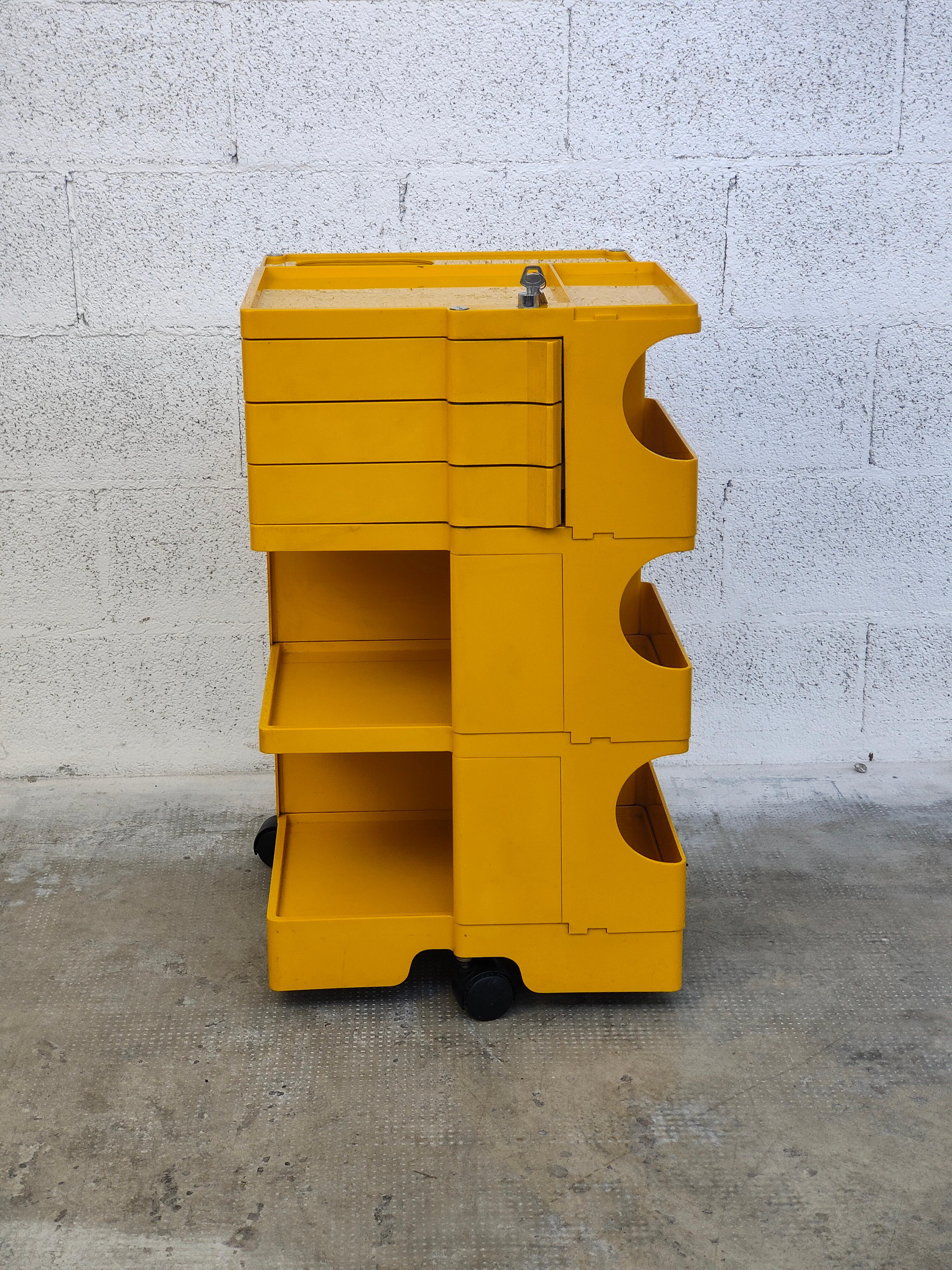 Iconic Boby cart in very rare yellow color designed by Joe Colombo and produced by Bieffeplast 1970s .
This “Boby” trolley or portable storage system was designed by Joe Colombo in 1969. 
A very handy trolley made of ABS plastic. It has many