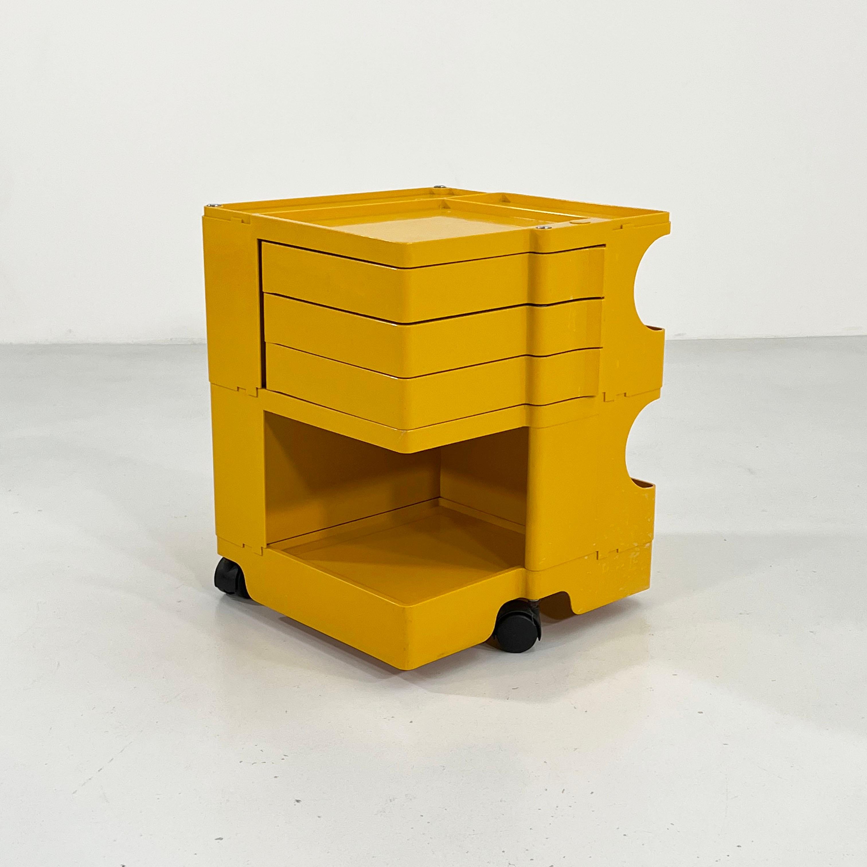 Designer - Joe Colombo 
Producer - Bieffeplast
Model - Boby Trolley
Design Period - Sixties
Measurements - Width 41 cm x Depth 44 cm x Height 52 cm
Materials - Plastic
Color - Yellow
Light wear consistent with age and use.
Comments - Light wear