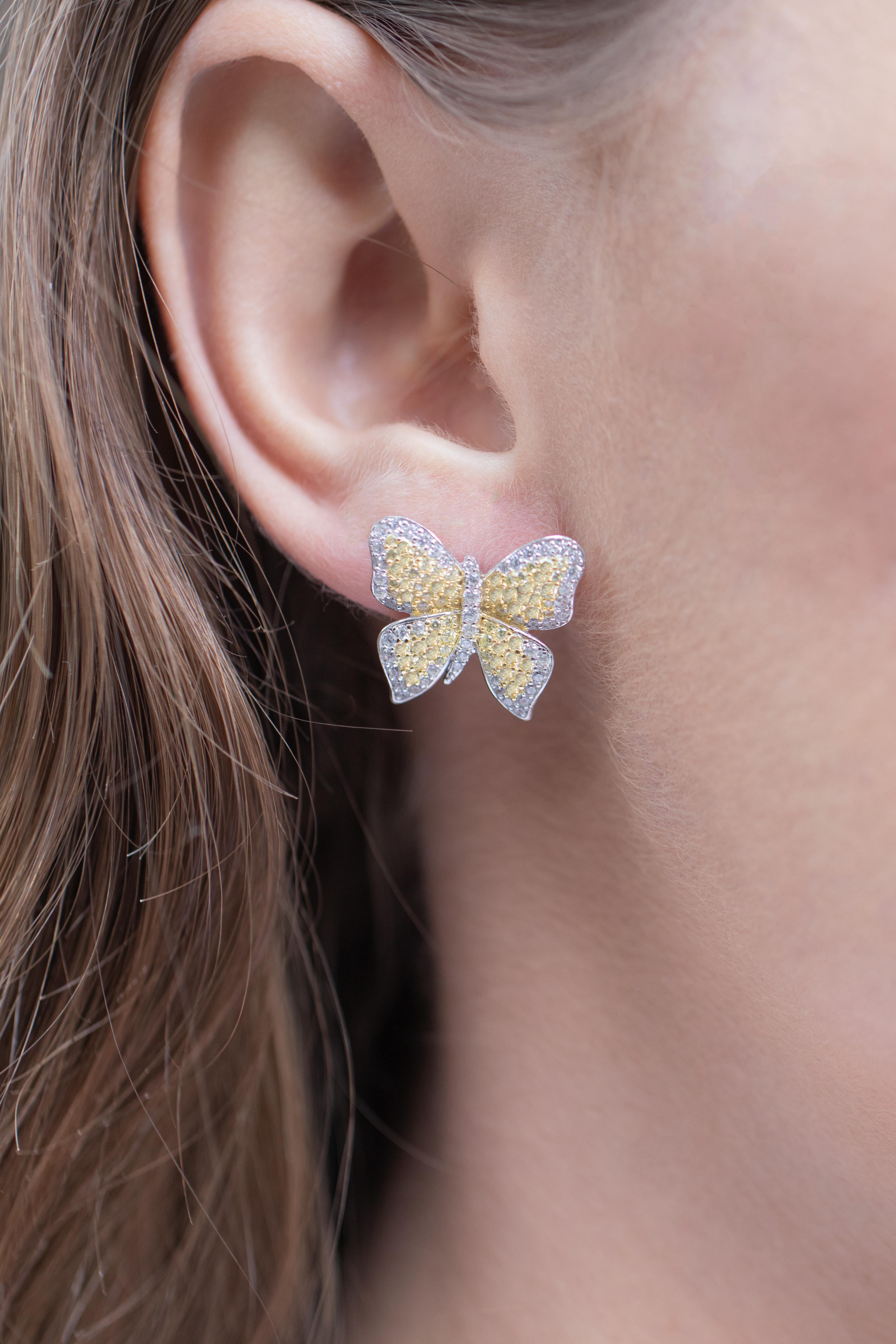 Butterfly Earrings 
Gemstone: Very Fine Cubic Zirconia
Metal: Rhodium Finish Sterling
Style: French