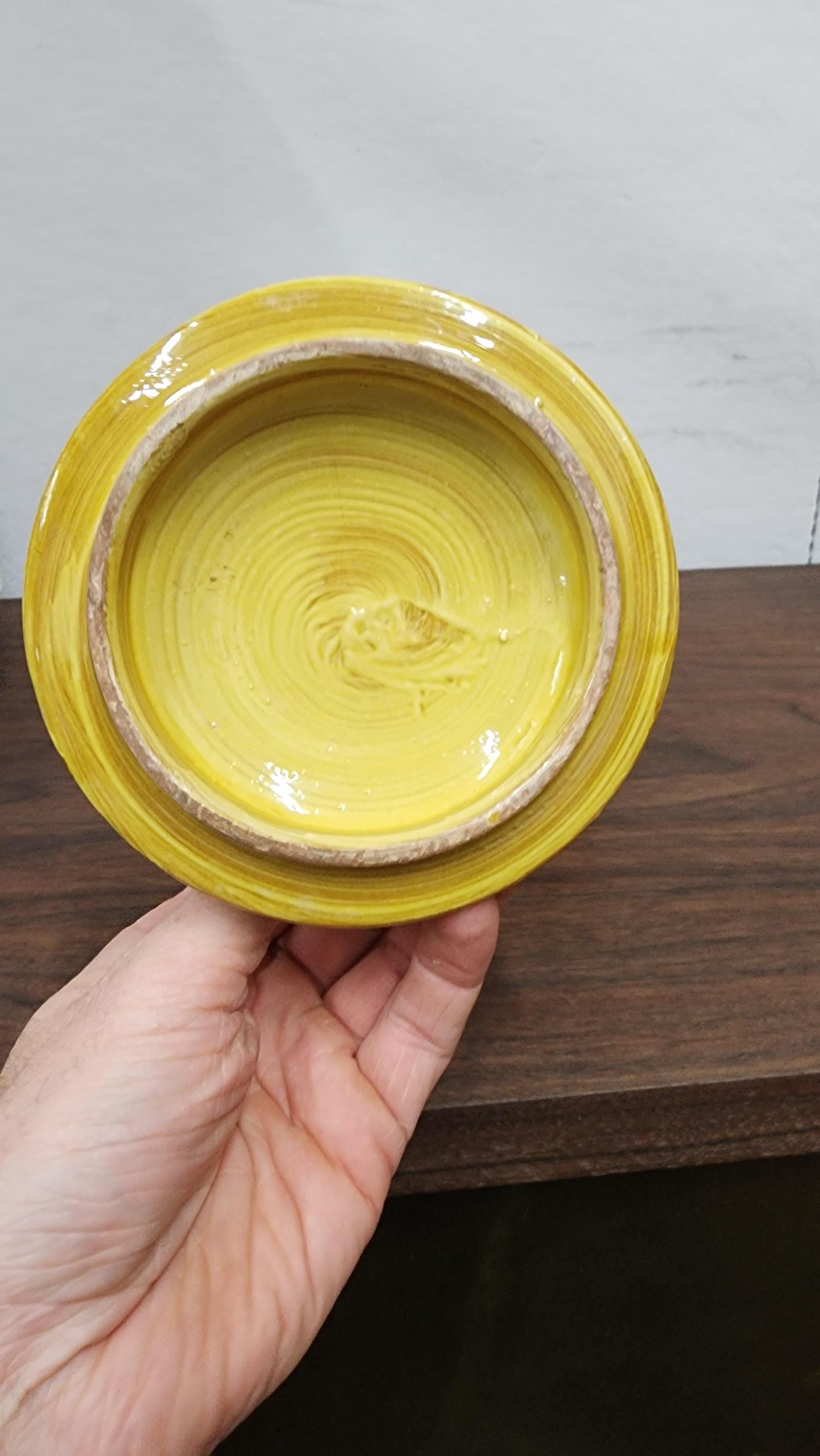 Awesome yellow floral decor lidded catchall bowl by Aldo londi for bitossi. the lid functions as a candle holder. signed in underside