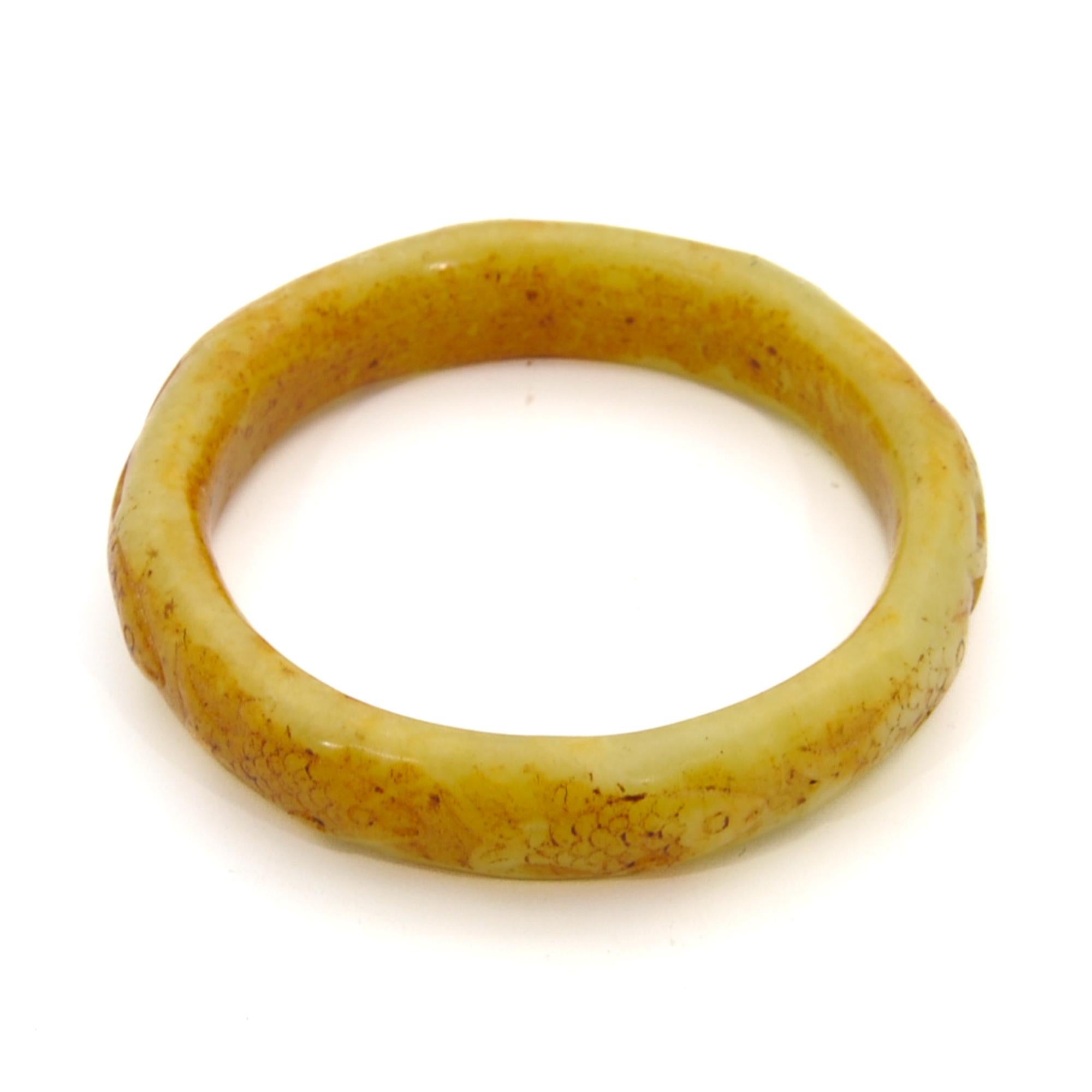 Women's Yellow Carved Fish Serpentine Mid-Century Bangle Bracelet For Sale