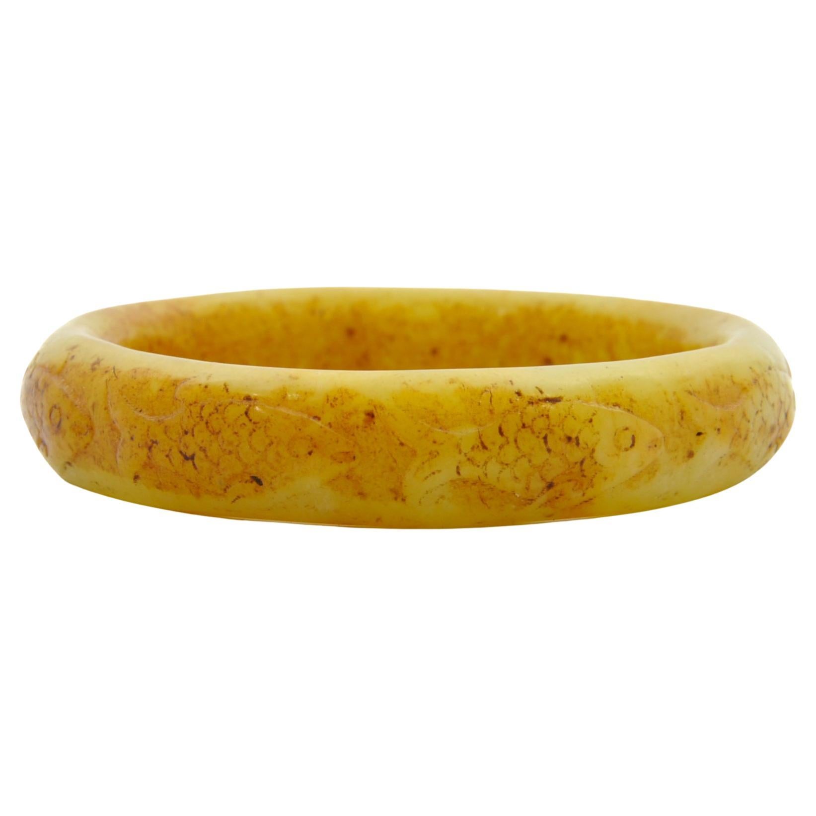 Yellow Carved Fish Serpentine Mid-Century Bangle Bracelet For Sale