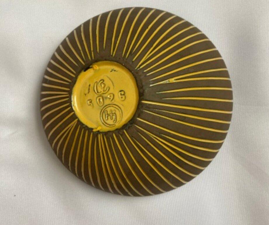 One of ten earthenware bowl and vase designs, the ‘Kokos’, or Coconut, series was only produced in 1954. This piece is one of a sought after design by the innovative and renowned Swedish artist, Hjördis Oldfors. The details of linear relief are a