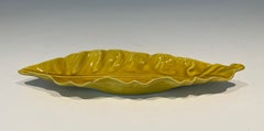 Yellow ceramic vide-poche (a slight damage on the side). French work marked.