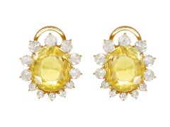 Yellow Ceylon sapphire and diamond cluster earrings, circa 1960.
