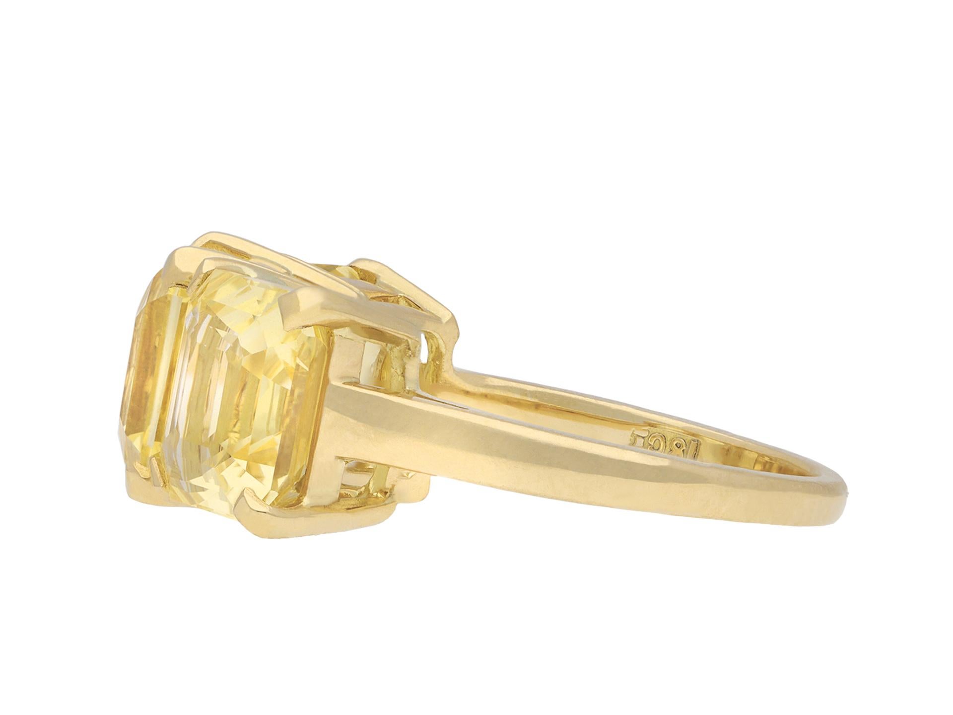 Yellow Ceylon sapphire three stone ring. Set with three octagonal emerald-cut natural unenhanced yellow Ceylon sapphires in open back claw settings with a combined weight of 10.64 carats, to an impressive geometric three stone design featuring