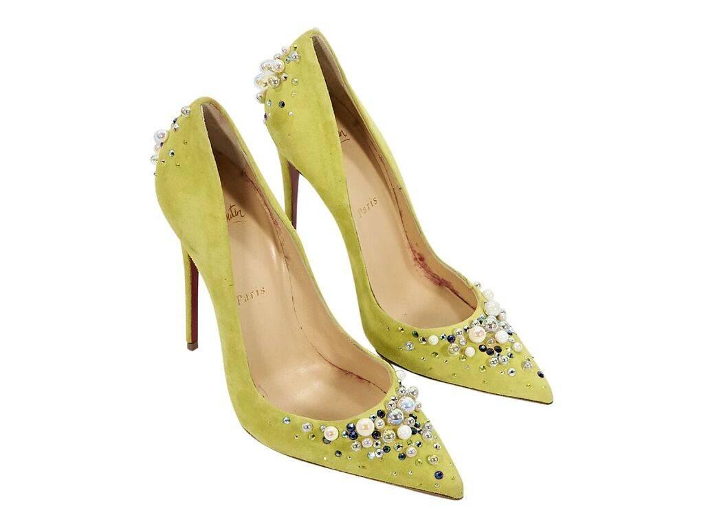 Product details:  Yellow suede Candidate pumps by Christian Louboutin.  Embellished with faux pearls and Swarovski crystals.  From the Fall 2016 collection.  Point toe.  Iconic red sole.  Slip-on style.  Label size FR 39.  5
