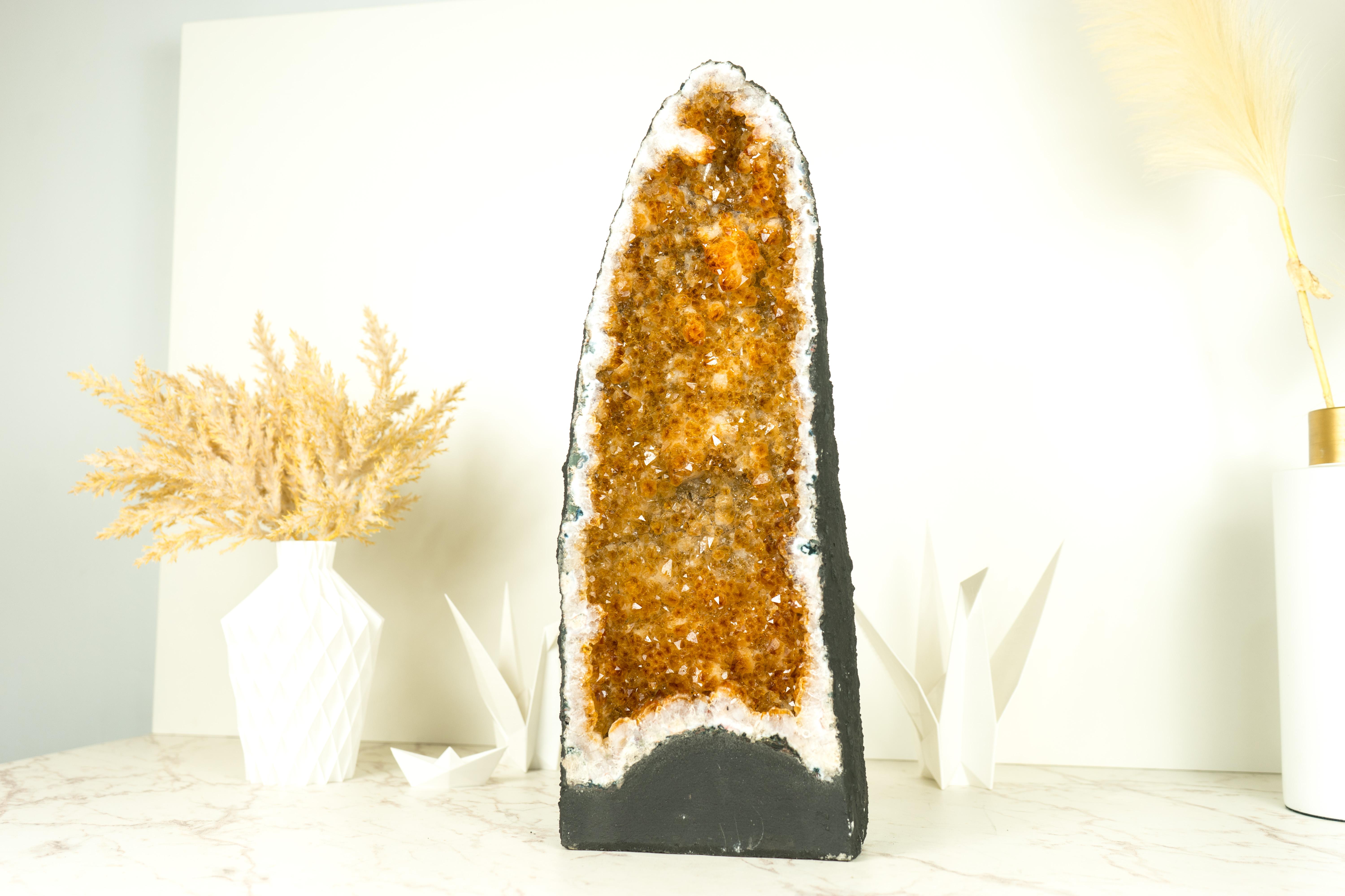Gorgeous in many ways, this Tall Yellow Citrine is a magnificent natural artwork. Combining natural colors with stunning formation and delicate flower stalactites growth, this geode will gracefully adorn your space with its striking presence and