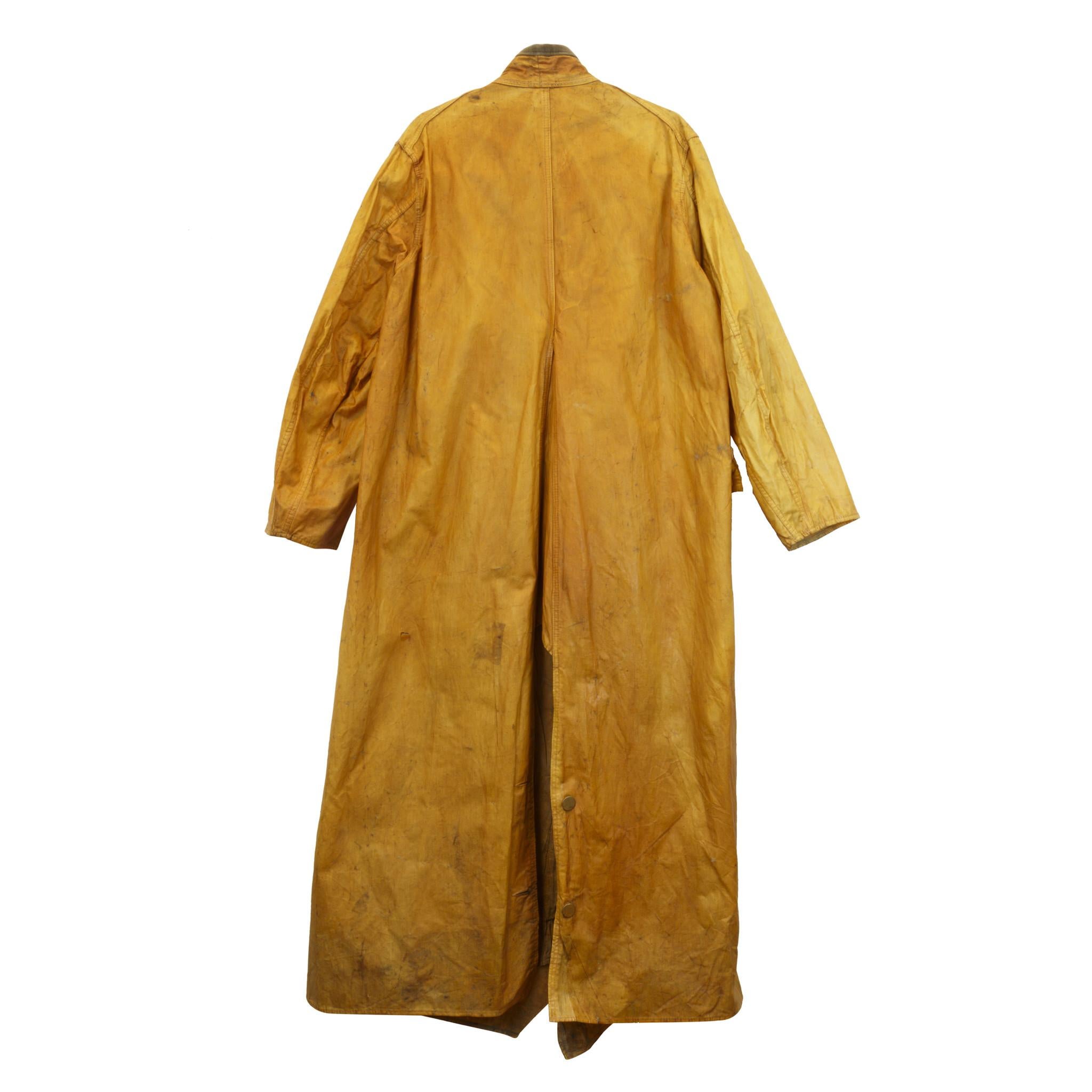 Yellow oil cloth cowboy slicker with slit back outside pockets and brass buttons. Corduroy collar, no makers mark but there were only 3 makers.

Period: Last quarter of the 19th century.

Origin: Western

Size: Large; 46-18.

Family Owned &