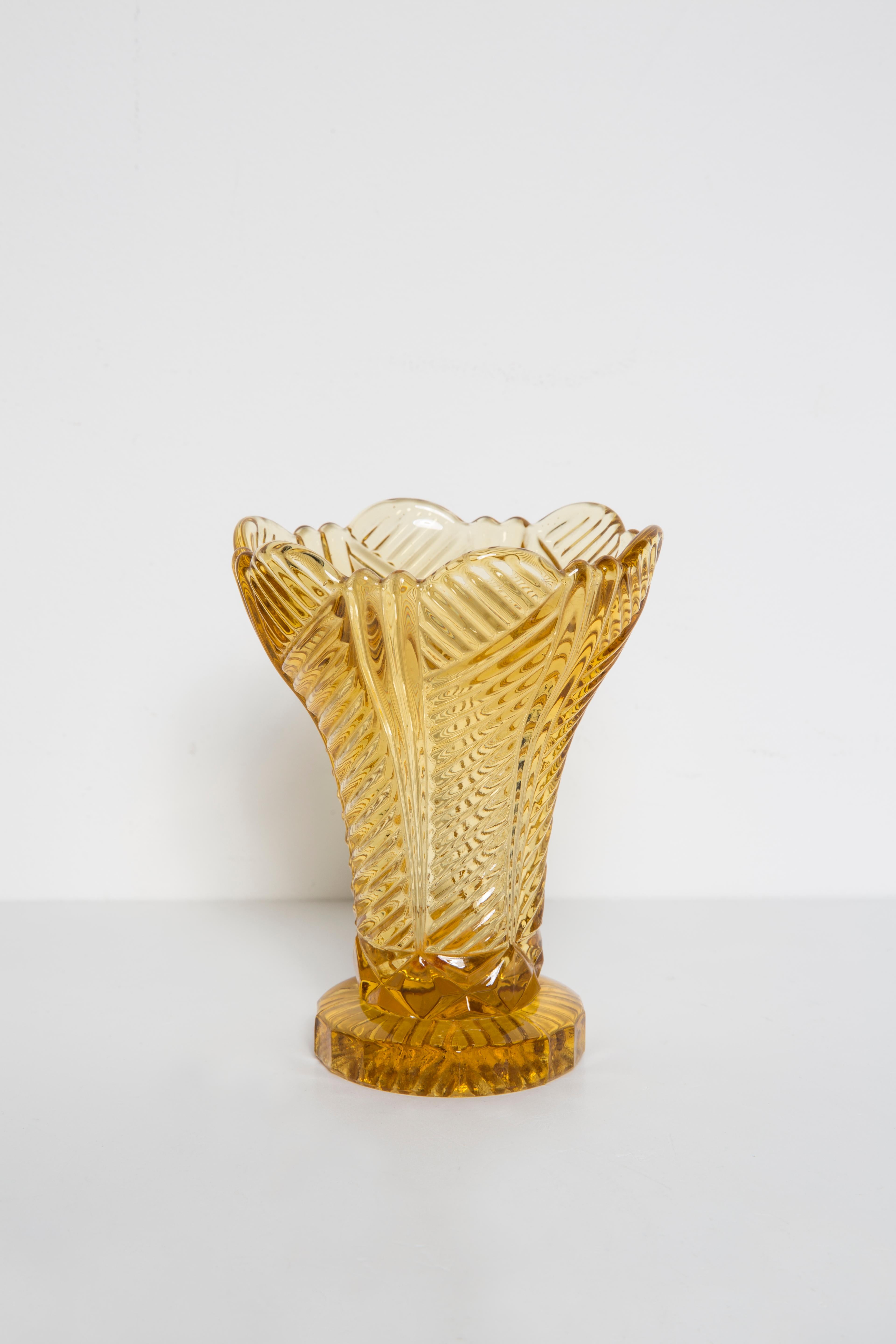 Produced in 1960s.

Pressed glass in perfect condition.
The vase looks like it has just been taken out of the box.
The picture reflects the color in which it presents live.

No jags, defects etc. 
The irregular surface of the object reflects and