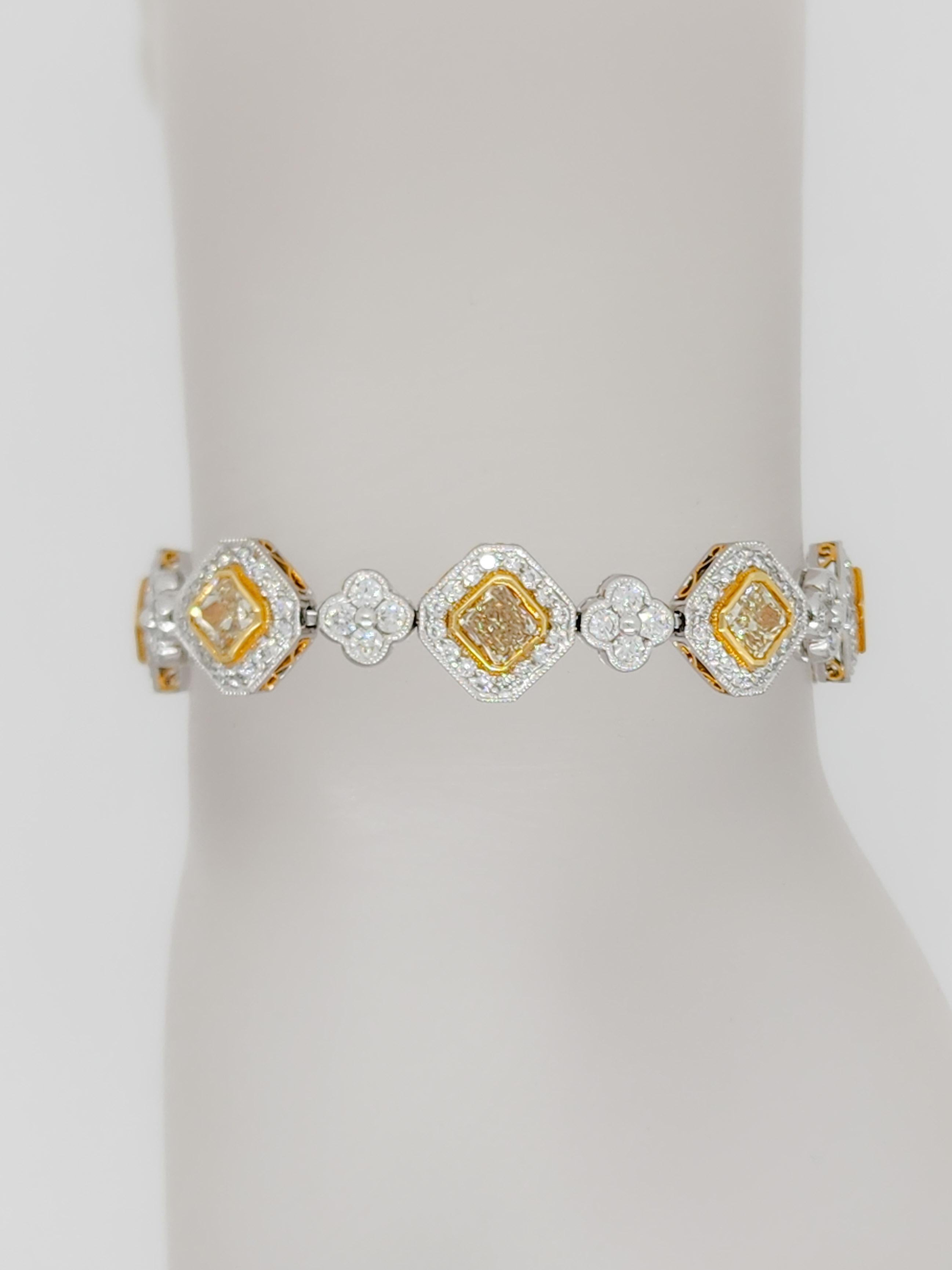 Beautiful 5.78 ct. yellow diamond square radiants with 3.31 ct. white diamond rounds.  Handmade in 18k yellow and white gold.  Length is 7