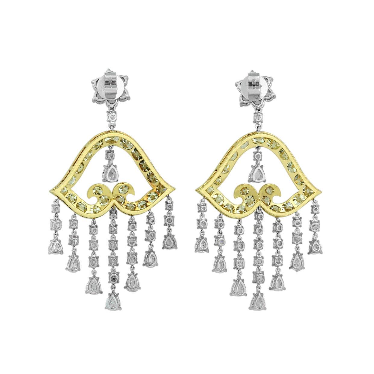 Impressive 27.90 carats of yellow diamond and white diamond chandelier earrings crafted in platinum and 18 karat yellow gold. The earrings have 13.89 carats of fancy yellow diamonds set in 18 karat yellow gold and 13.01 carats of white diamonds set