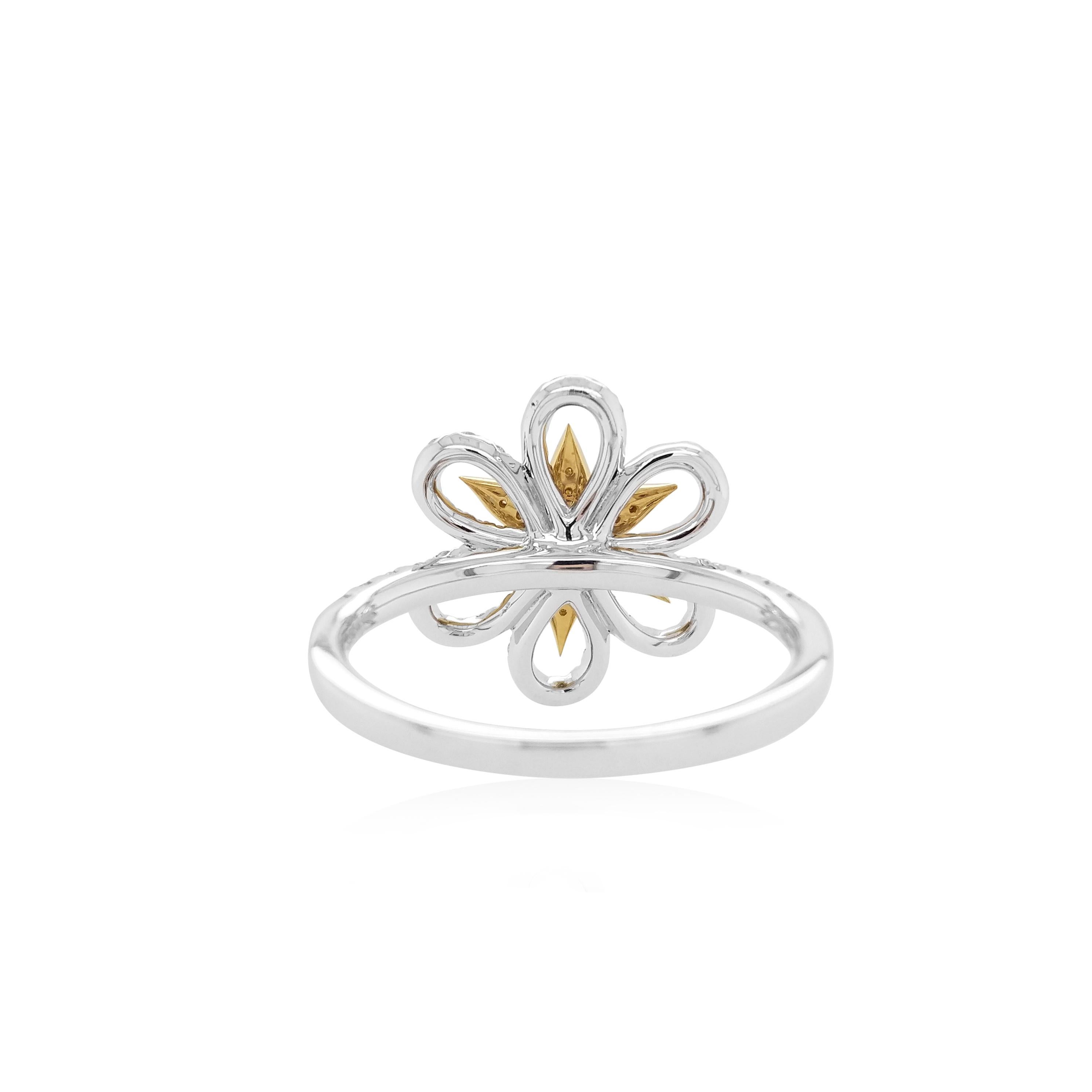 This unique floral ring features striking natural Yellow diamonds at its centre, surrounded by a bold pattern sparkling white diamonds. The perfect piece to take you from day to night, this ring will elevate any outfit - especially when paired with