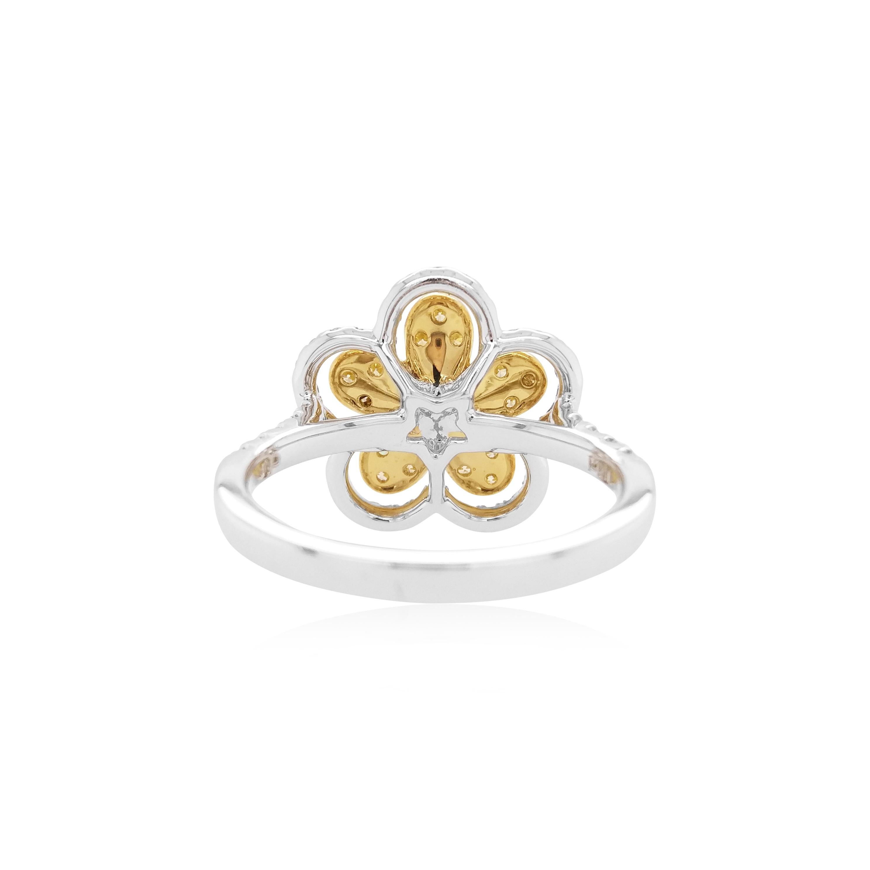 This unique floral ring features spectacular natural White and Yellow diamonds at its centre, surrounded by a bold pattern dazzling white diamonds. The perfect piece to take you from day to night, this ring will elevate any outfit - especially when
