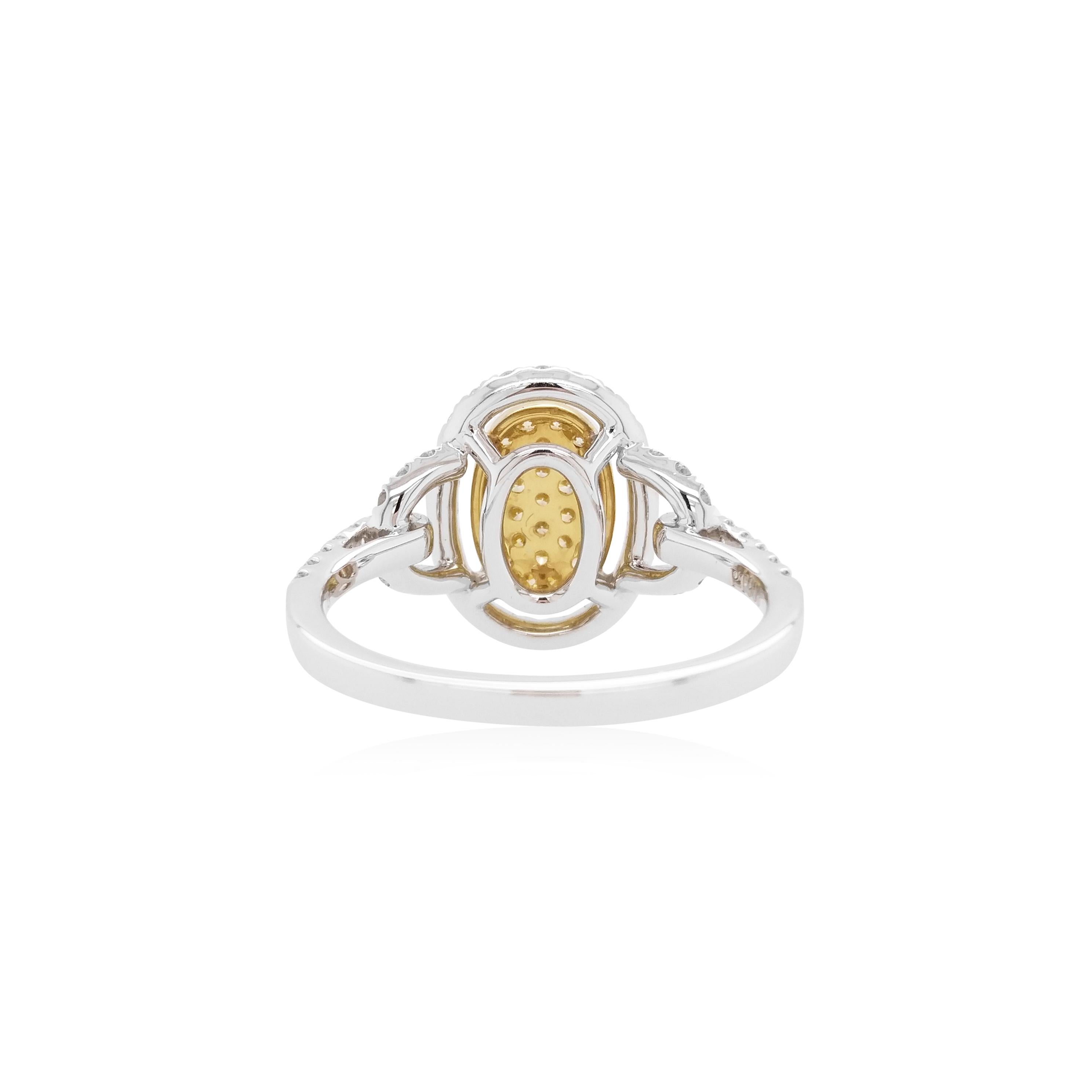 This unique ring features striking natural Yellow diamonds at its forefront, surrounded by a halo of sparkling white diamonds. The perfect piece to take you from day to night, this ring will elevate any outfit - especially when paired with the