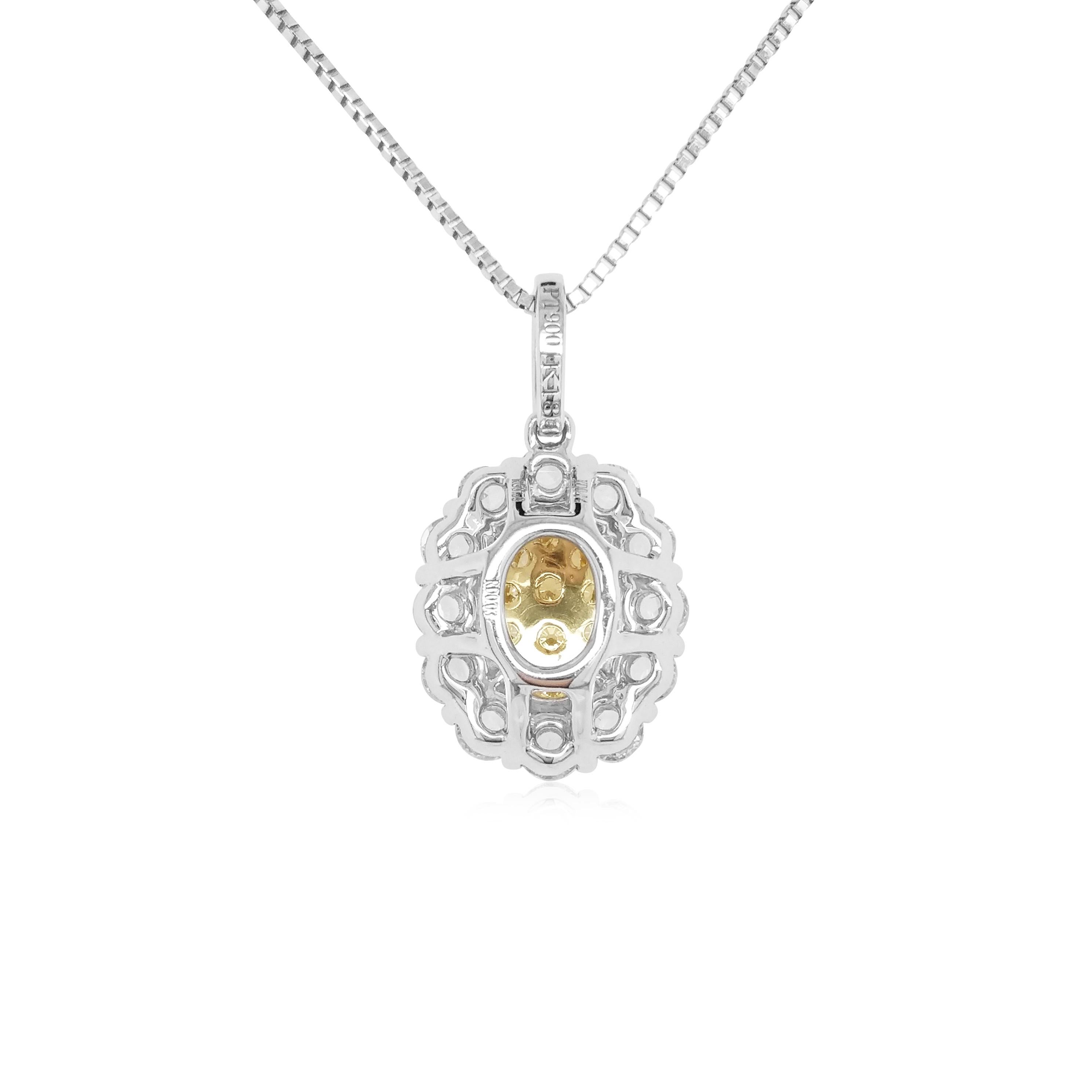This mesmeric platinum pendant features natural Yellow diamonds at its forefront, accentuated by a halo of glistening Rose-cut white diamonds which surrounds it. Bold, yet intricate, this one-of-a-kind pendant will add a sumptuous touch of colour to