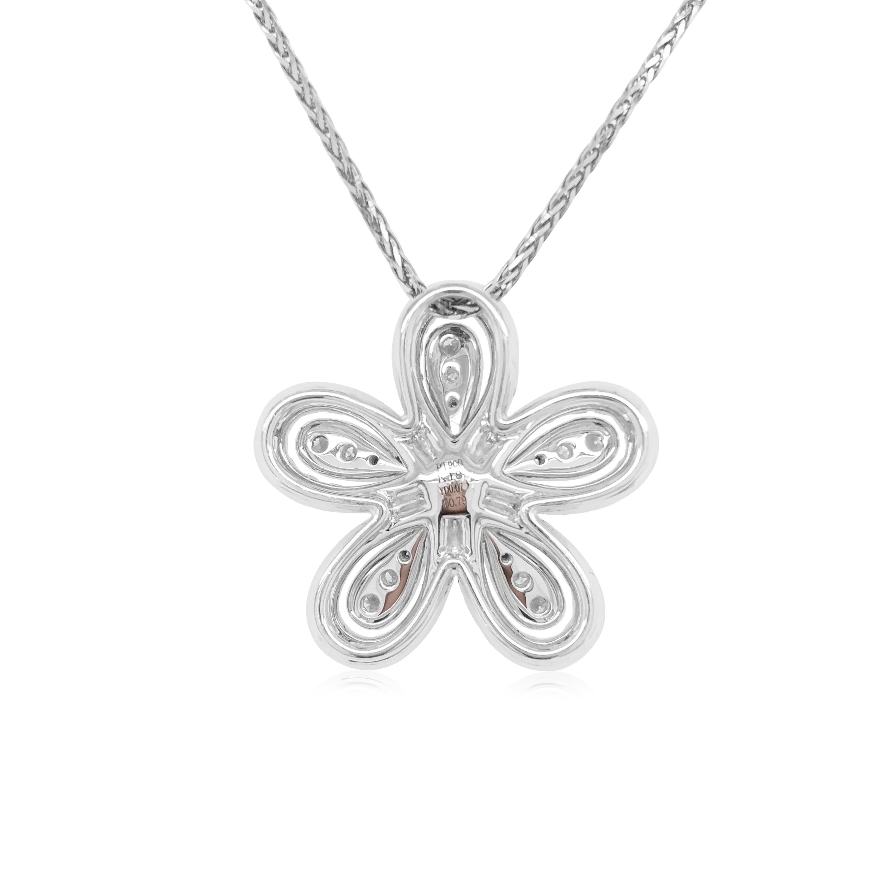This unique flower shaped pendant features striking Yellow diamonds at the heart of the design. The rich colour of these diamonds is complimented perfectly by the delicate platinum floral design which completed by a combination of glistening white