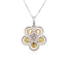 Collana con ciondolo in platino con diamante giallo e diamante bianco