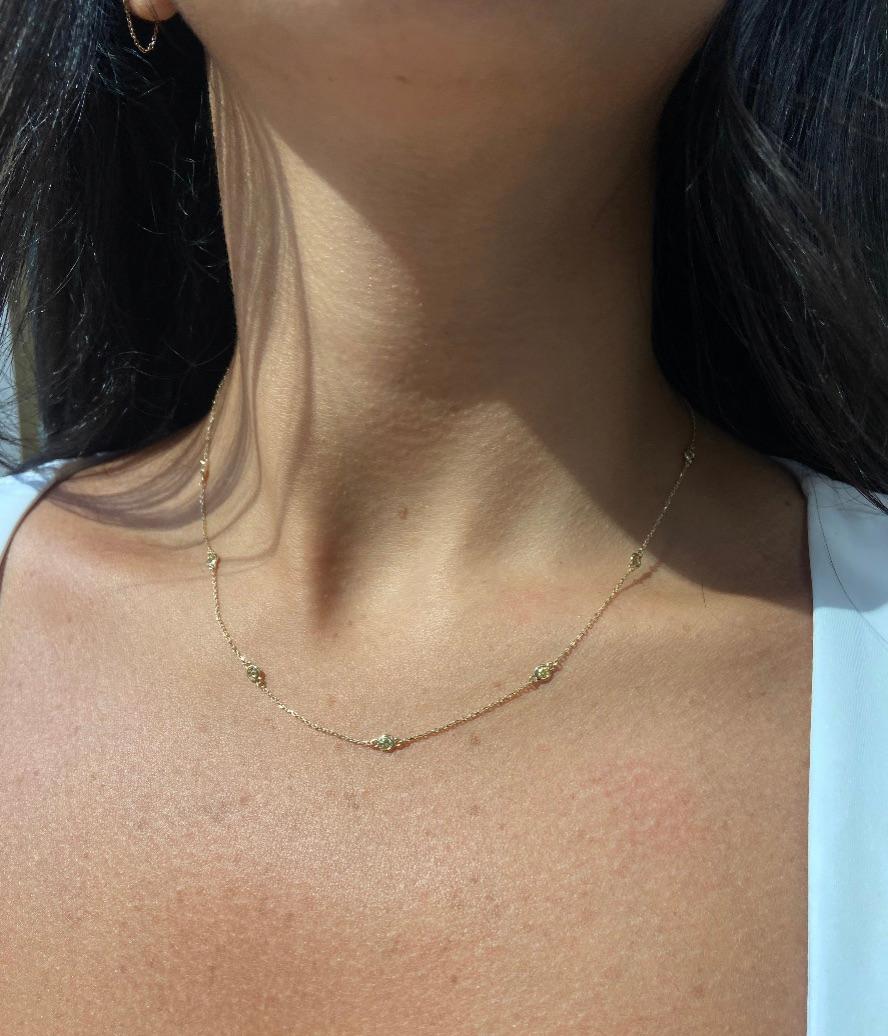 Add a touch of sunshine to your jewelry collection with this exquisite yellow diamond station necklace. Featuring ten round fancy yellow stones with a total weight of 0.53 carats, each gem is delicately spaced along a 17-inch strand of warm 14k rose