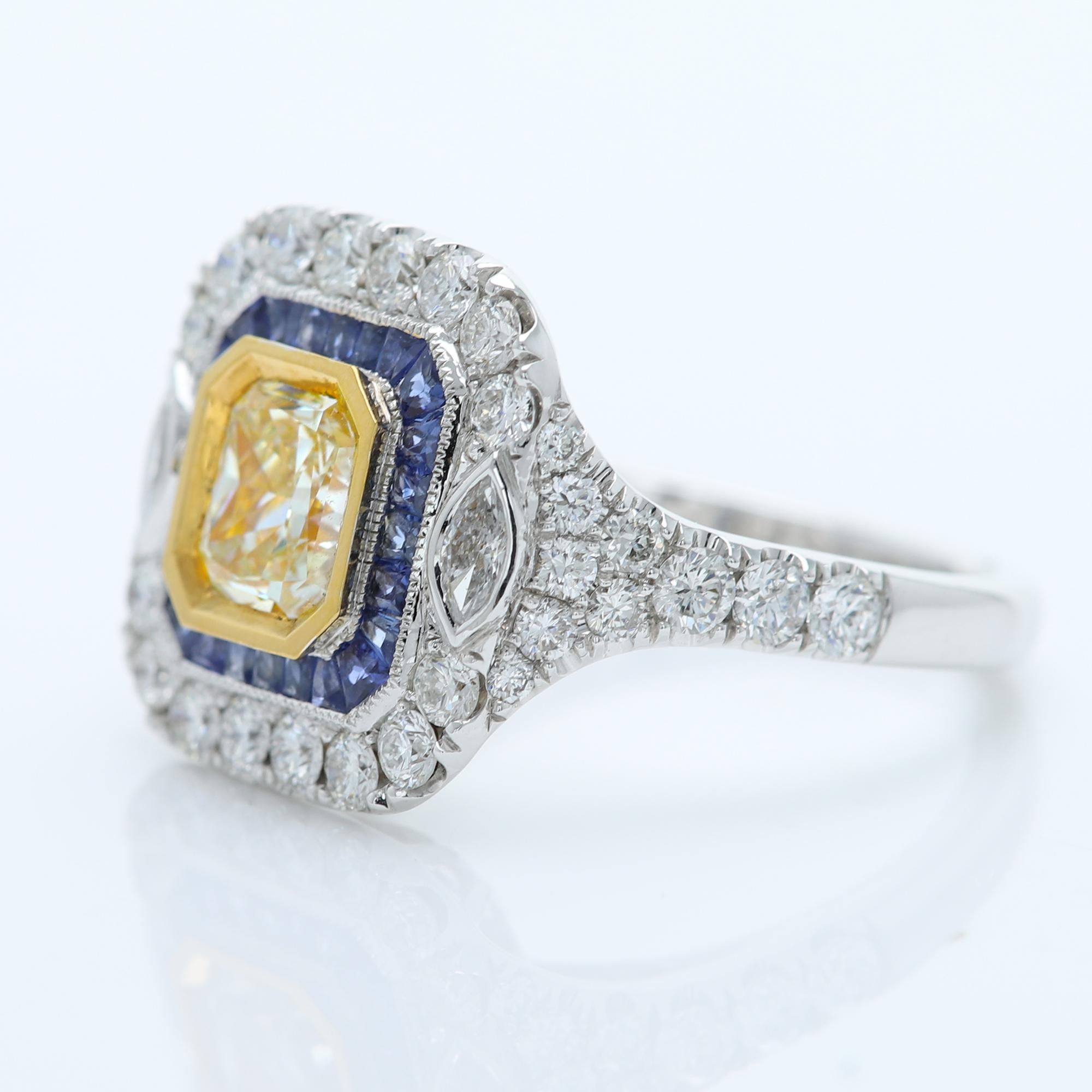 Art Deco Style & Bold Statement Colorful Ring
Center is Yellow Diamond surrounded with Blue Sapphire, sides have regular white Diamonds
All stones are Natural
18k Two Tone Gold 
Yellow Diamond size - 1.03 carat (7x6 mm) -SI
Small Diamonds 1.11 carat