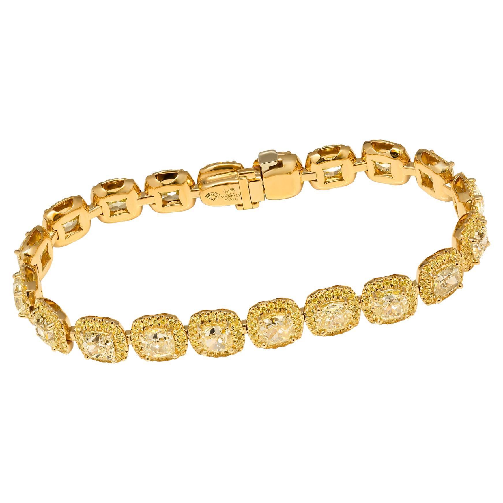 High End Fancy Bracelet!
This Luxurious Fancy Yellow Diamond Bracelet crafted in 18K Yellow Gold, featuring 20 Large Cushion Cuts Yellow Diamonds, each diamond is 1.00+ct in average (combined weight of 20.63 carats).
Delicate halo around  each stone