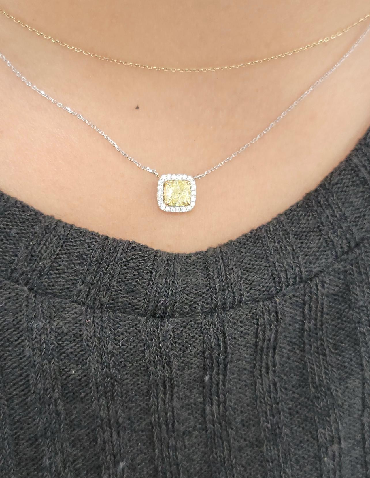 Beautiful 18kt White and Yellow Gold pendant with a 1 carat GIA Fancy Light Yellow Cushion set in a delicate halo design 

Thin classic chain 

Making Extraordinary Attainable with Rare Colors
