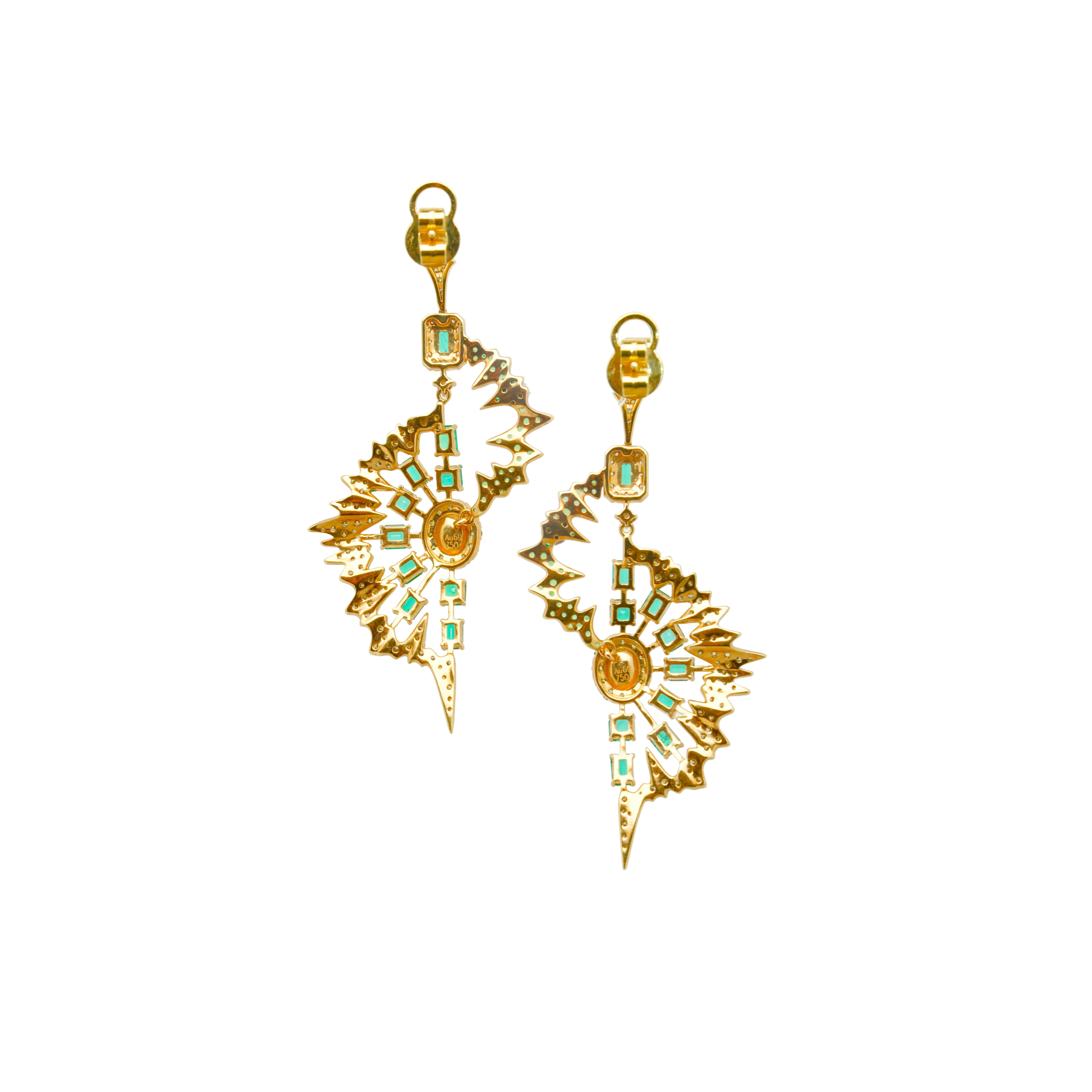 The Chakras of Trees Earrings from 'The Psychedelic Light Collection' by Austy Lee. This unique pair of earrings is set with Fancy Yellow Diamonds, Colombian Emeralds, Tsavorites on green color-plated 18K Yellow Gold.

Product Details:
Diamond - 26