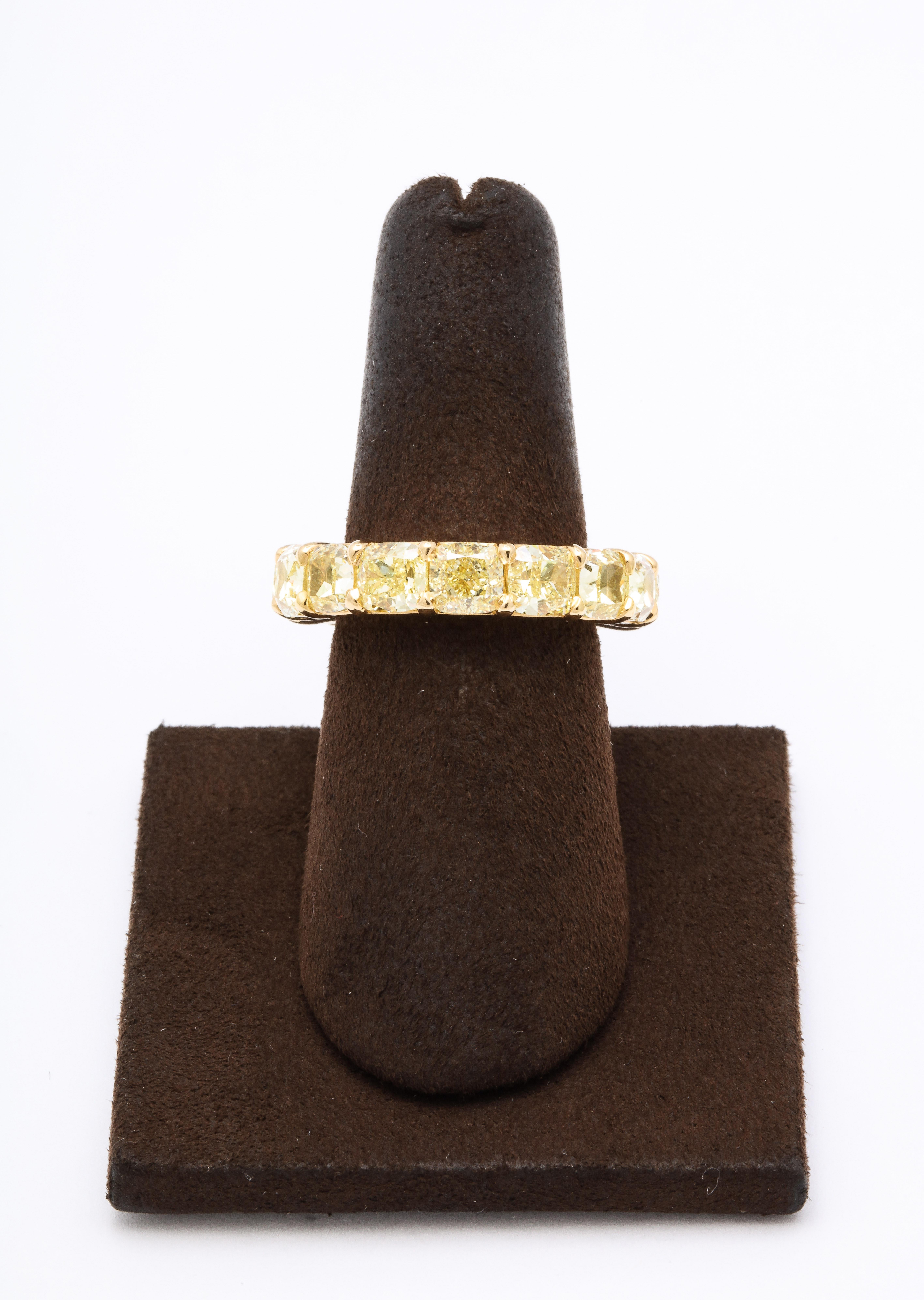 
A beautiful yellow diamond eternity band set with cushion cut diamonds. 

12.15 carats of Fancy Yellow VS diamonds set in 18k yellow gold. 

This ring stands alone and looks fabulous stacked with other bands. 

Size 6.75, this ring can be slightly
