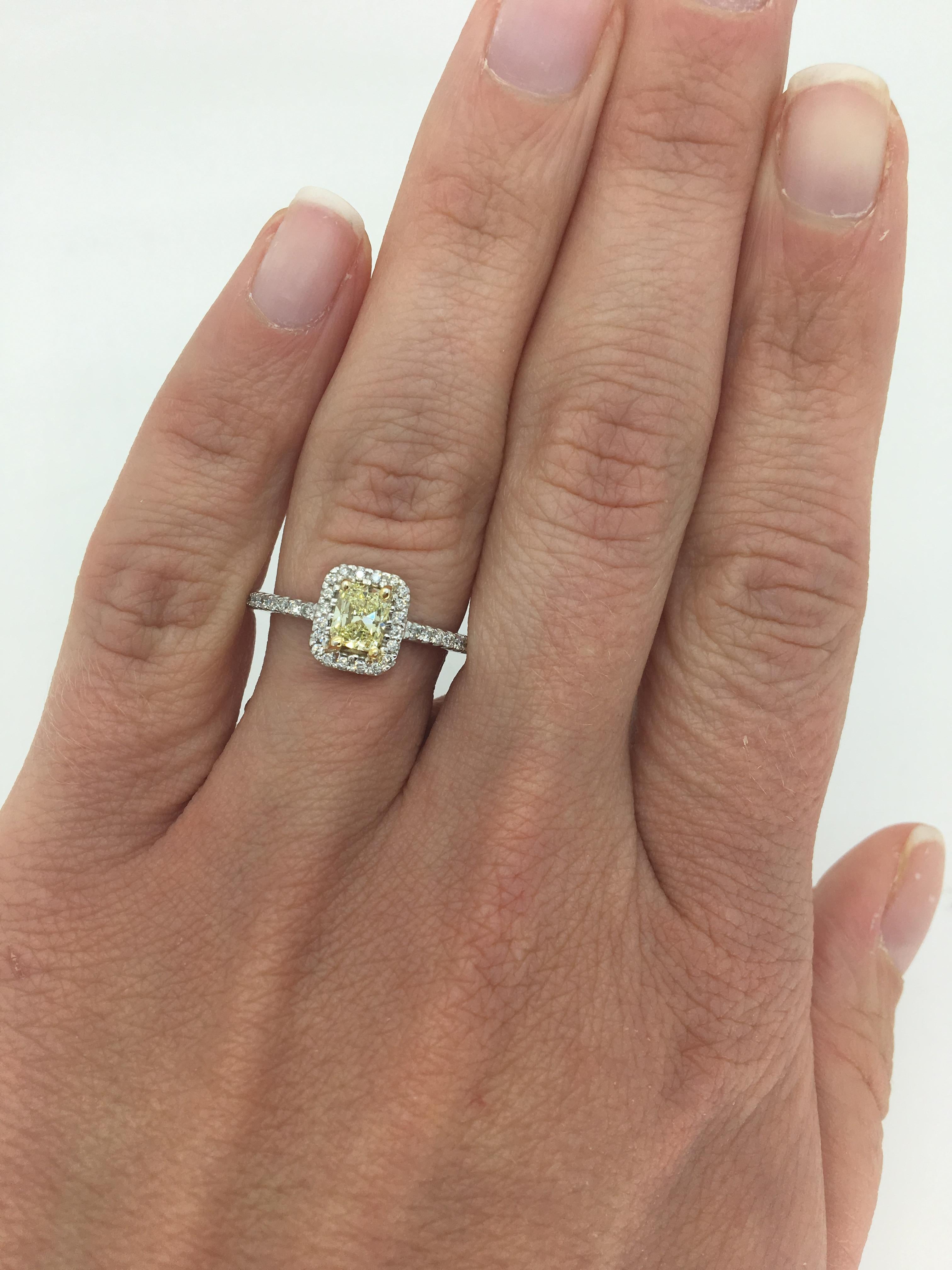 This elegant diamond ring features .56CT Radiant Cut Yellow Diamond, with a beautiful halo of white diamonds surrounding it.
 
Center Diamond Carat Weight: Approximately .56CT
Center Diamond Cut: Radiant Cut
Center Diamond Color: Yellow
Center