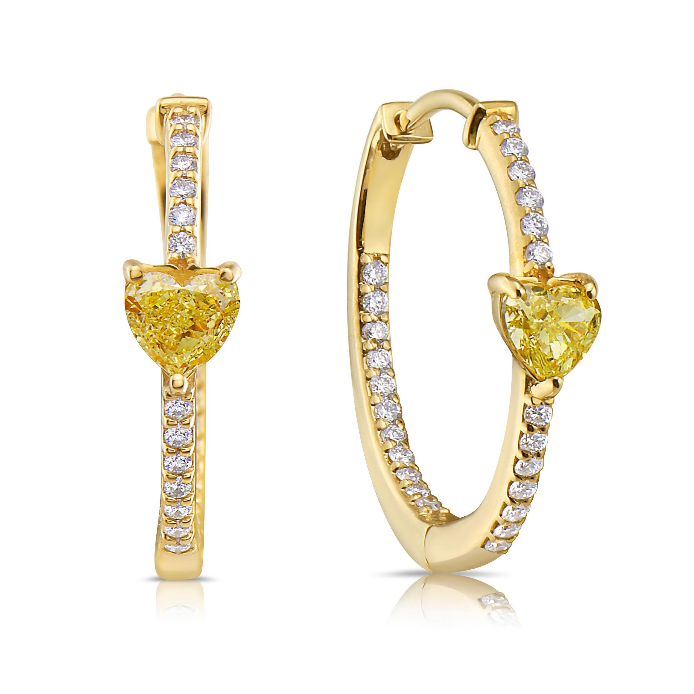 Yellow Diamond Heart Shape Huggie Earrings: The perfect addition to your ear stack or to wear alone!

2 Fancy Yellow Heart Diamonds
Natural white diamonds
VS clarity
0.86 Carat Total Weight
Set 14k Yellow Gold
15mm width
Handmade in NYC

This piece